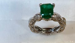 2 Carat Natural Emerald Cut Emerald & 0.85 Ct Diamond Ring in Platinum