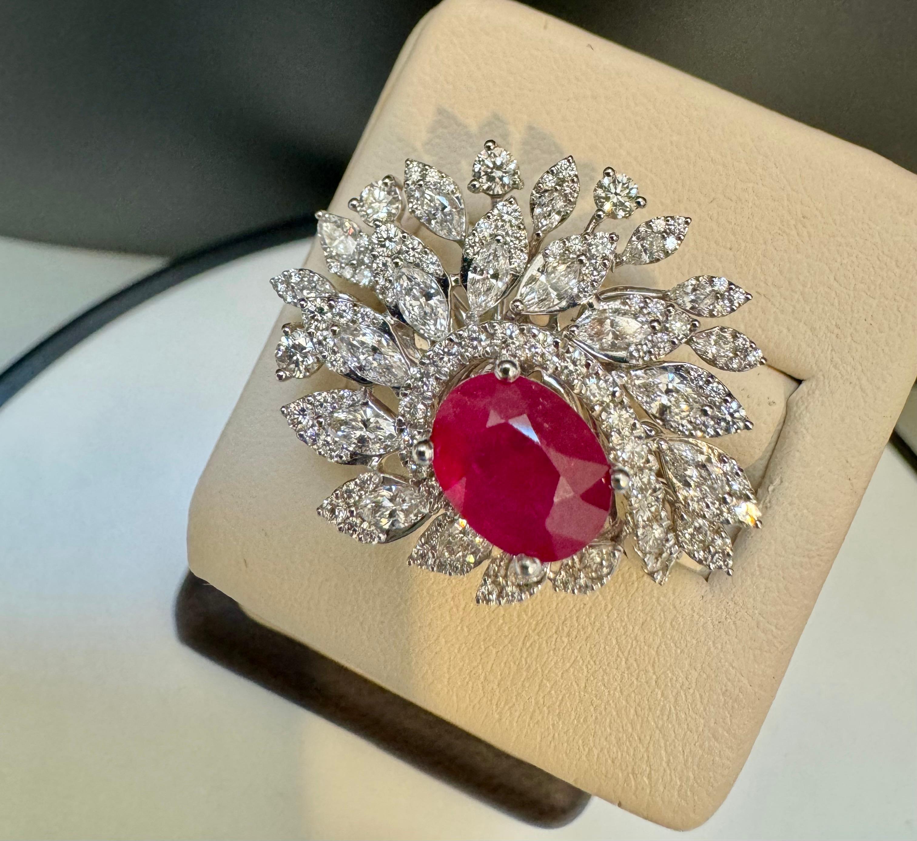 2 Carat Natural Oval  Ruby and 2.5 Carat Diamond 18 Karat White Gold Ring S 5.75
Introducing our exquisite 18 Karat Gold Ring, featuring a stunning 2 carat natural oval Ruby and approximately 2.5 carats of brilliant cut diamonds. This ring is a true