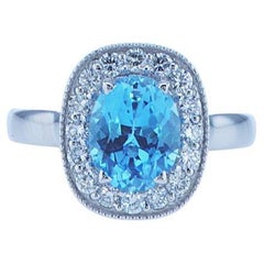 2 Karat ovaler blauer Topasring mit halber Karat Akzent-Diamanten