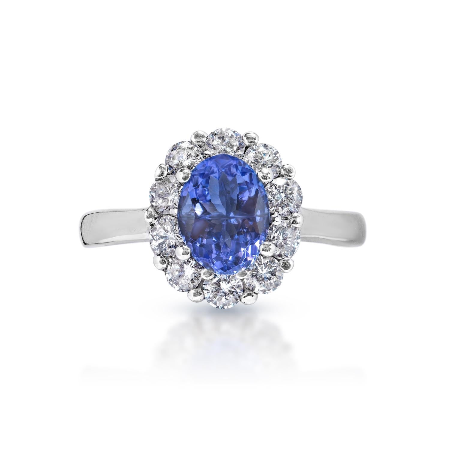 Earth Mined Center Tanzanite:
Carat Weight: 1.67 Carats
Color: Blue Tanzanite
Style: Oval Cut

Carat Weight: 0.82 Carats
Shape: Round Brilliant Cut
Setting: Halo
Metal: 14 Karat White Gold


Total Carat Weight: 2.49 Carats