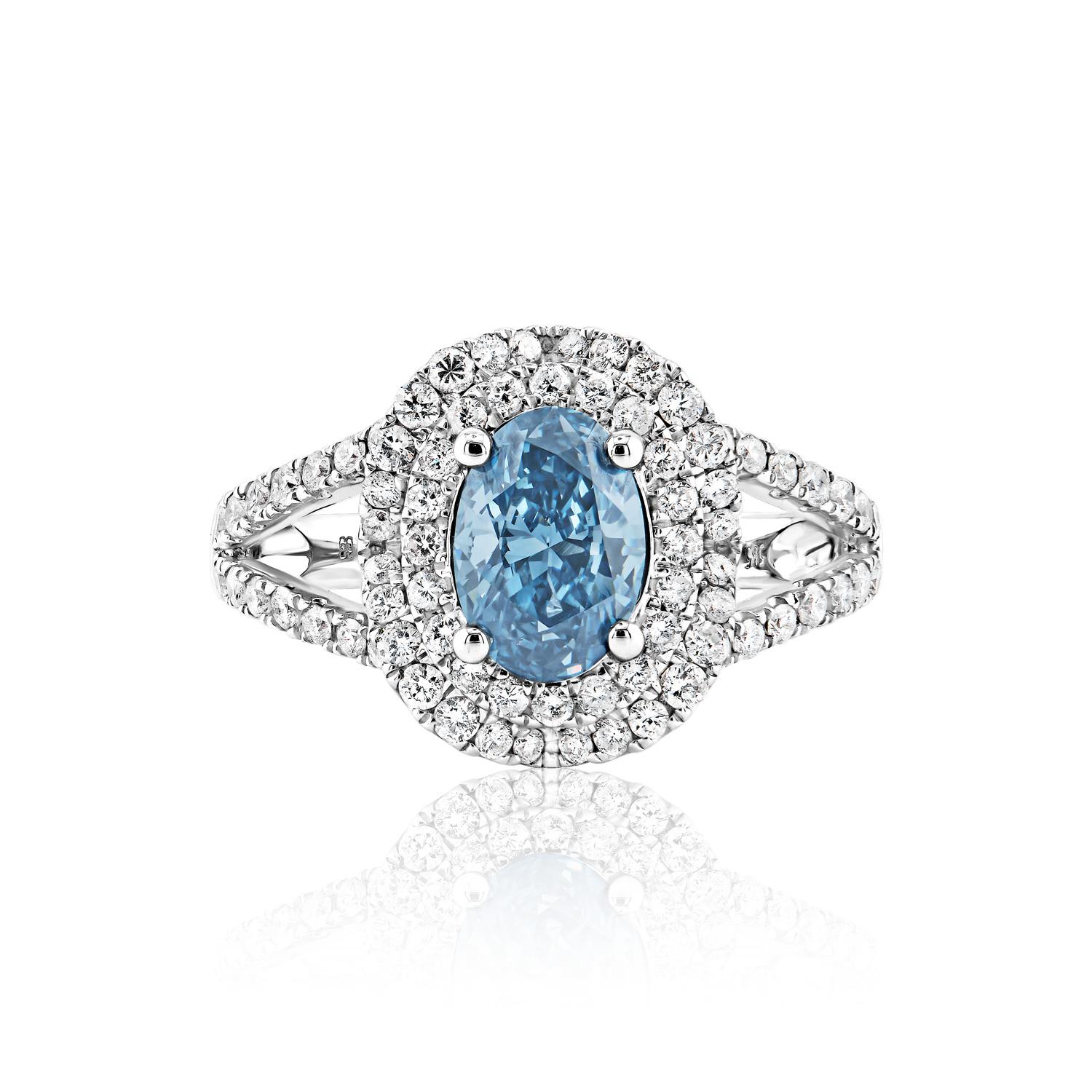 
GIA CERTIFIED
Center Diamond:

Carat Weight: 1.01 Carats
Color : Fancy Deep Greenish Blue
Style: Oval Cut

Ring:
Settings: Double Halo, Split shank & 4 Round Prong
Metal: 14 Karat White Gold 4.69 Grams
Style: Round Brilliant Cut
Carat Weight: 0.71