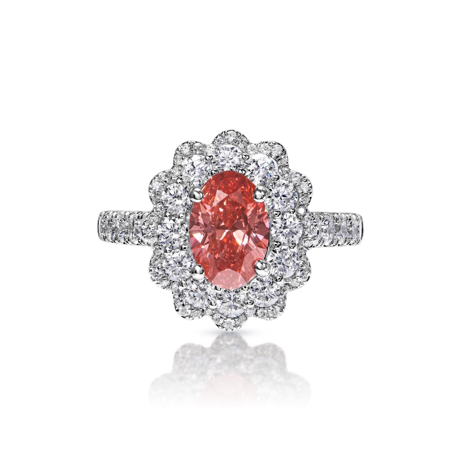 GIA CERTIFIED

Earth Mined Center Diamond:
Carat Weight: 1.06 Carats
Color: Fancy Vivid Pink*
Clarity: VS1
Style: Oval Cut

*This Diamond has been treated by one or more processes to change its color

Carat Weight: 1.13 Carats
Shape: Round Brilliant