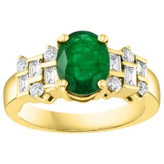 Antique 2 Carat Oval Cut Emerald and 0.5 Carat Diamond Ring 18 Karat Yellow Gold