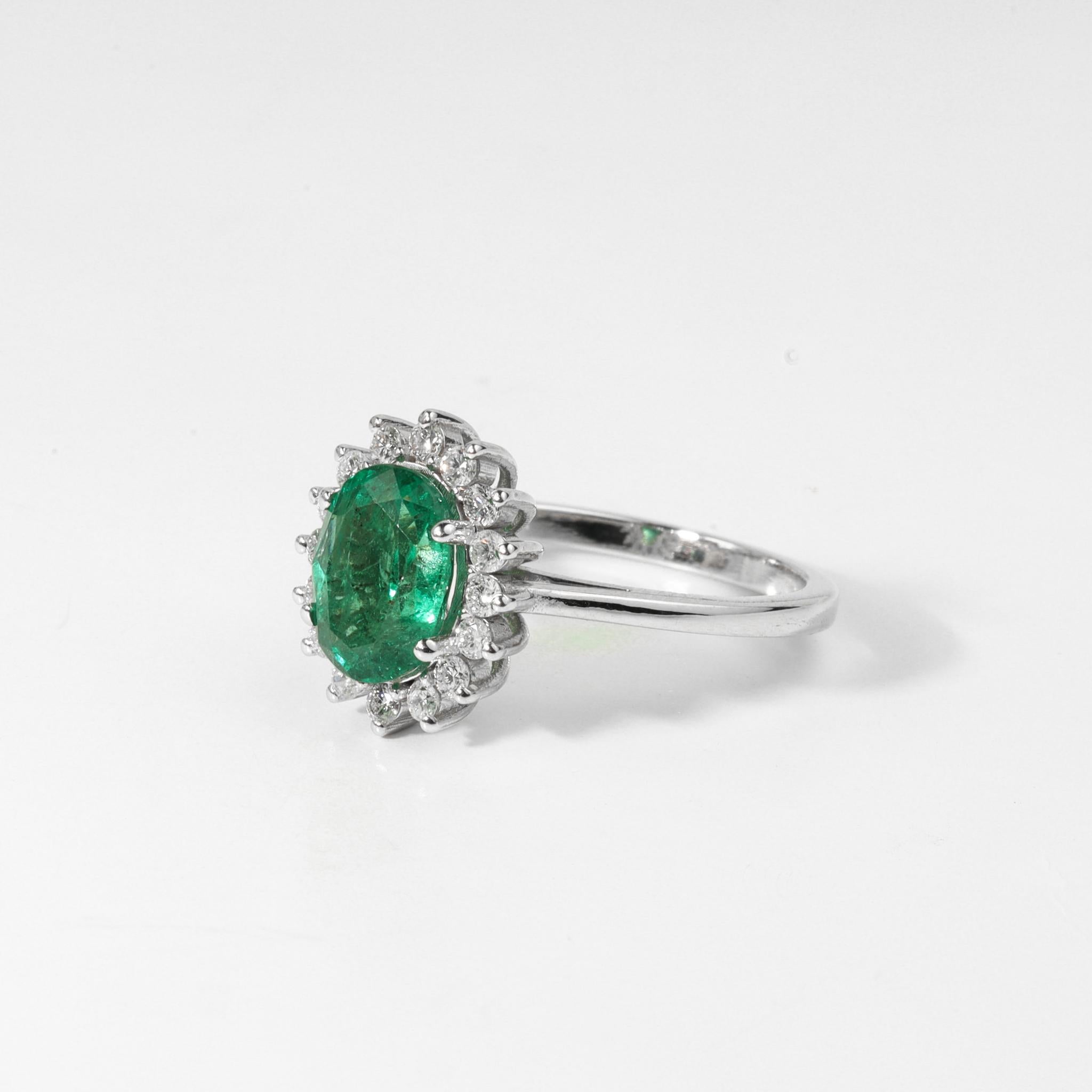 Art Deco 2 Carat Oval Cut Emerald And Diamond Halo Engagement Ring In 18k White Gold For Sale