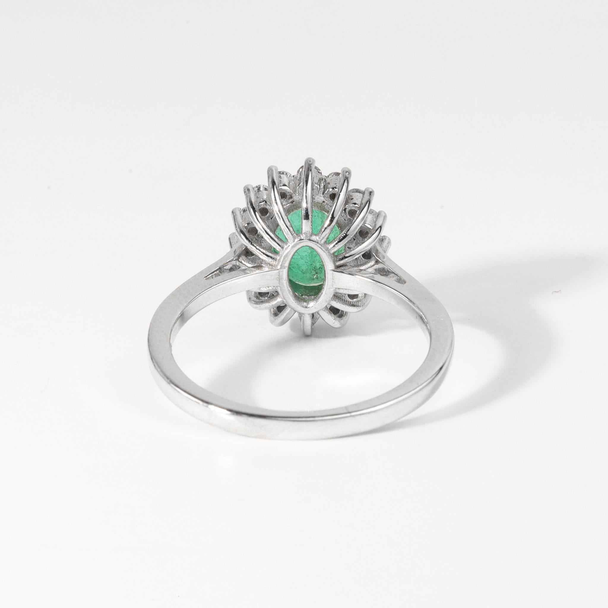 Women's 2 Carat Oval Cut Emerald And Diamond Halo Engagement Ring In 18k White Gold For Sale