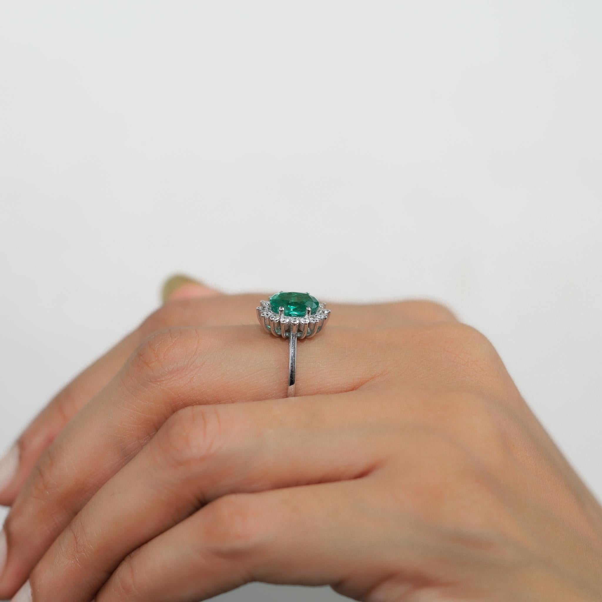 2 Carat Oval Cut Emerald And Diamond Halo Engagement Ring In 18k White Gold For Sale 3