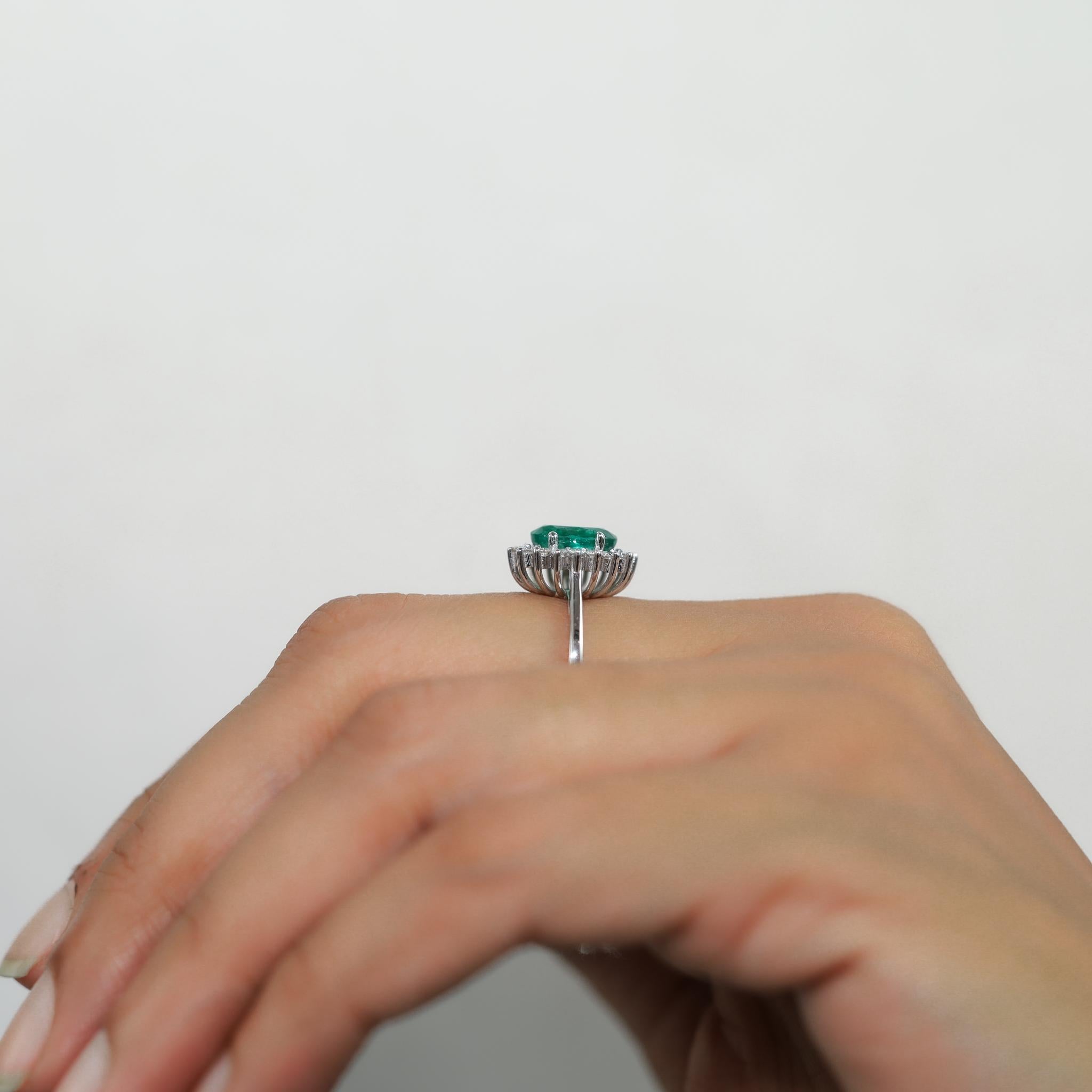 2 Carat Oval Cut Emerald And Diamond Halo Engagement Ring In 18k White Gold For Sale 4