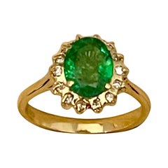 2 Carat Oval Cut Emerald 
Diamond Ring in 18 Karat Yellow Gold