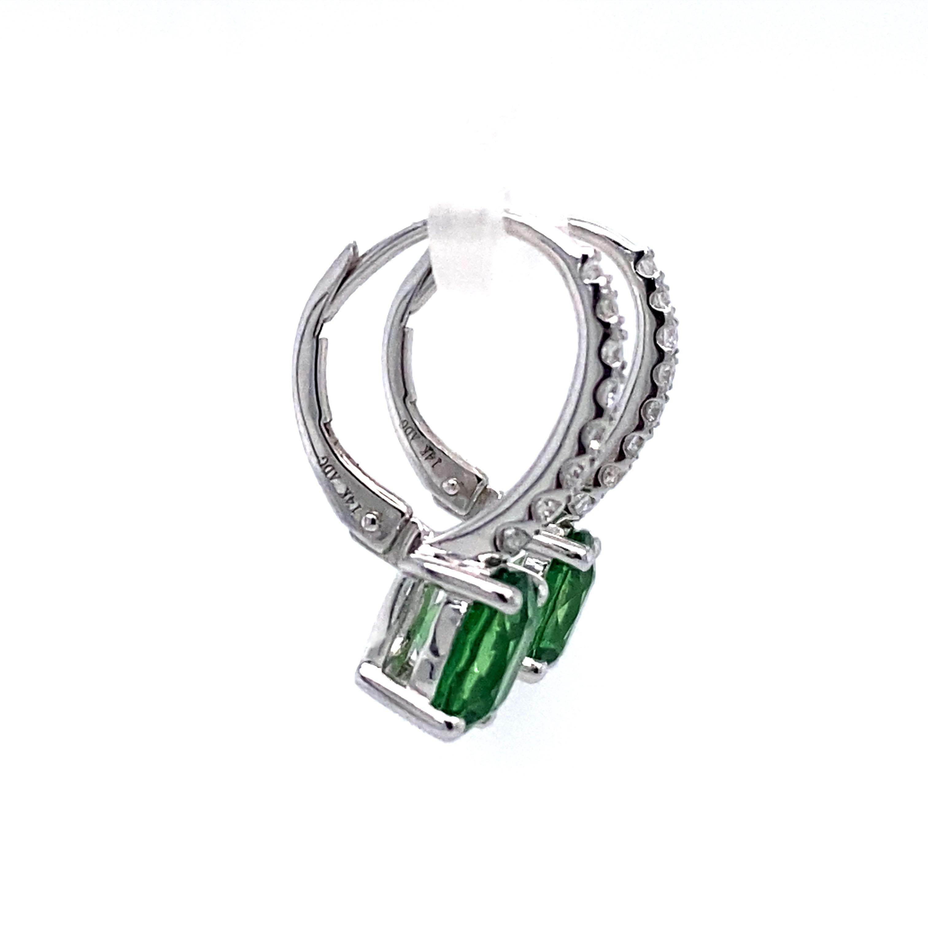 Circa: 1980s
Metal Type: 14 Karat White Gold
Weight: 3.4 grams
Dimensions: 0.75in Length

Peridot Details:

Carat: 2.0 carat total weight
Shape: Oval
Color: Vibrant green