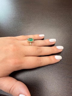 2 Carat Oval Shaped Emerald ring on Yellow gold