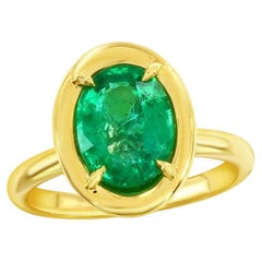 2 Carat Oval Shaped Emerald ring on Yellow gold