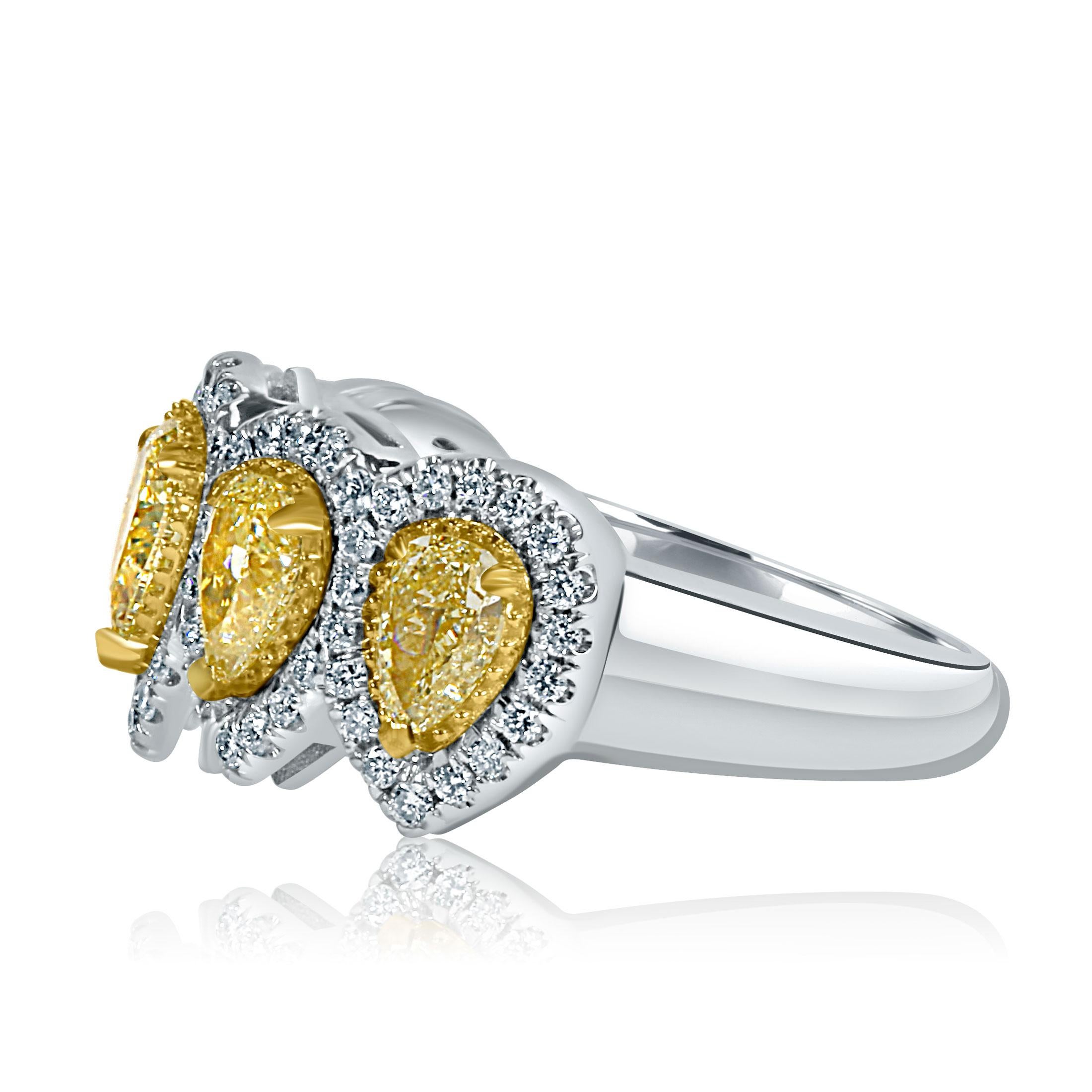 This sparkling wedding band features 1.55 carats five natural fancy light SI/I clarity yellow pear-cut diamonds, each beautifully surrounded by a micro-pave halo of colorless round-cut G/H color VS/Si clarity diamonds totaling weight of 0.45 carat,