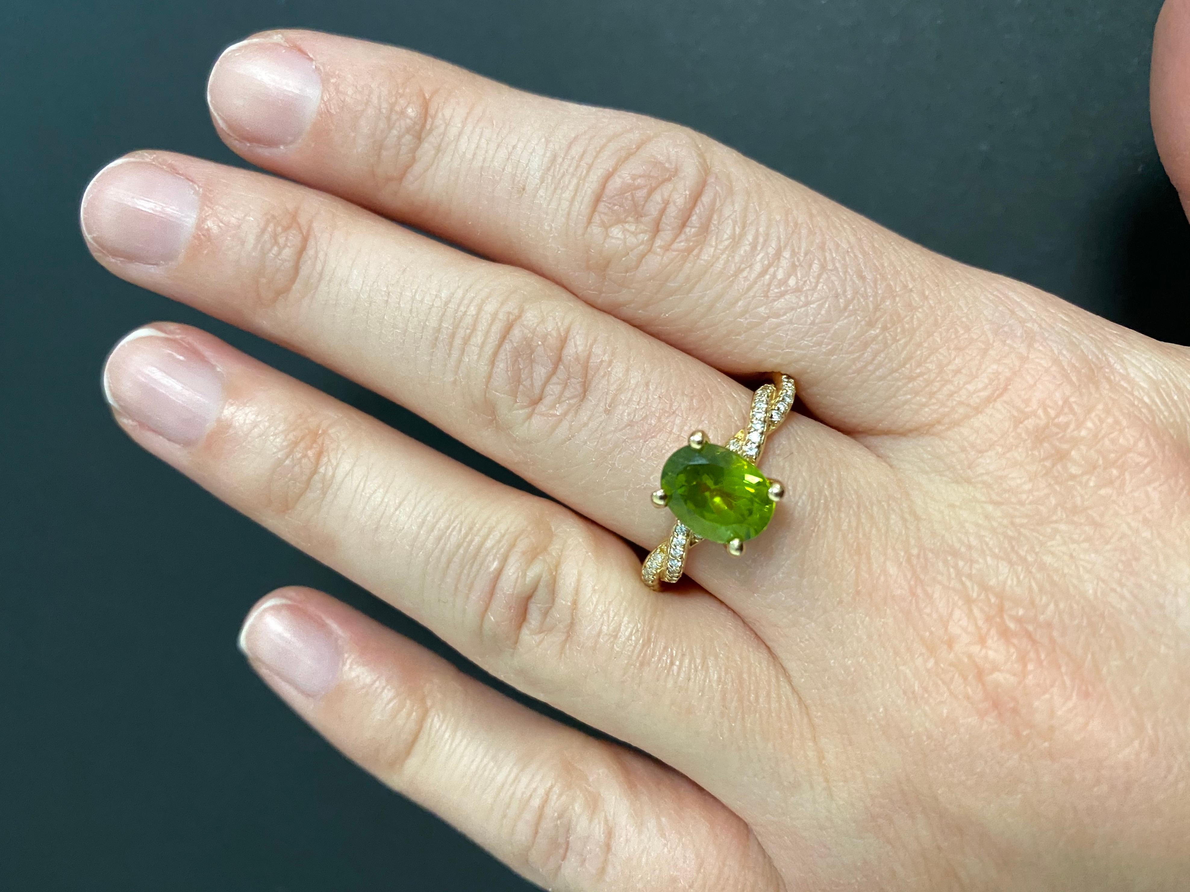 Material: 14k Yellow Gold 
Center Stone Details: 1 Oval Shaped Peridot at 2 Carats - Measuring 7 x 9 mm
Diamond Details: 34 Round Brilliant White Diamonds at 0.13 Carats - Clarity: SI / Color: H-I

Alberto offers complimentary sizing on all