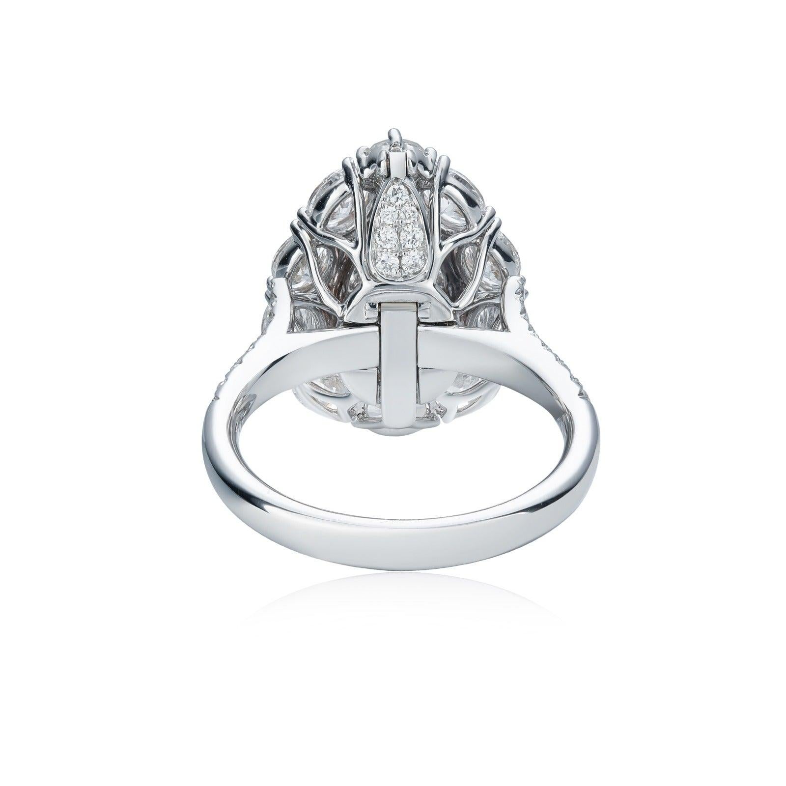 This exquisite piece features a 2.01 carat GIA-certified Very Light Pink diamond at its center, with I1 clarity. Surrounded by 1.70 carats of sparkling diamonds, the design showcases a delicate yet luxurious look. Handcrafted in 18k white gold, this