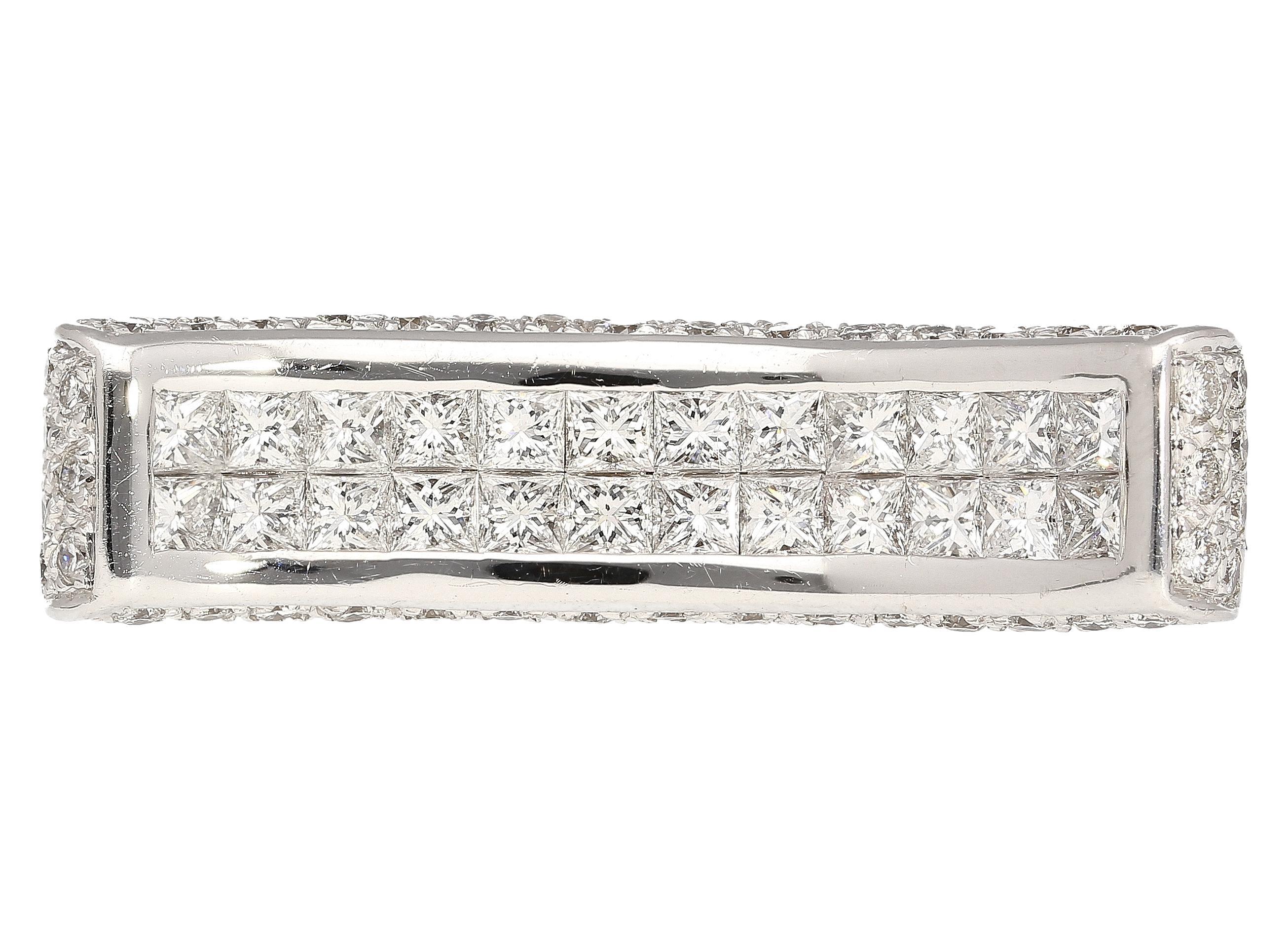 2 carat princess cut diamond encrusted curving ring. 16 princess cut diamonds on the face of the ring totaling 0.89 carats. 72 round cut diamonds on the sides of the curved ring, totaling 1.11 carats. Diamonds set in bezel and pave setting. The ring