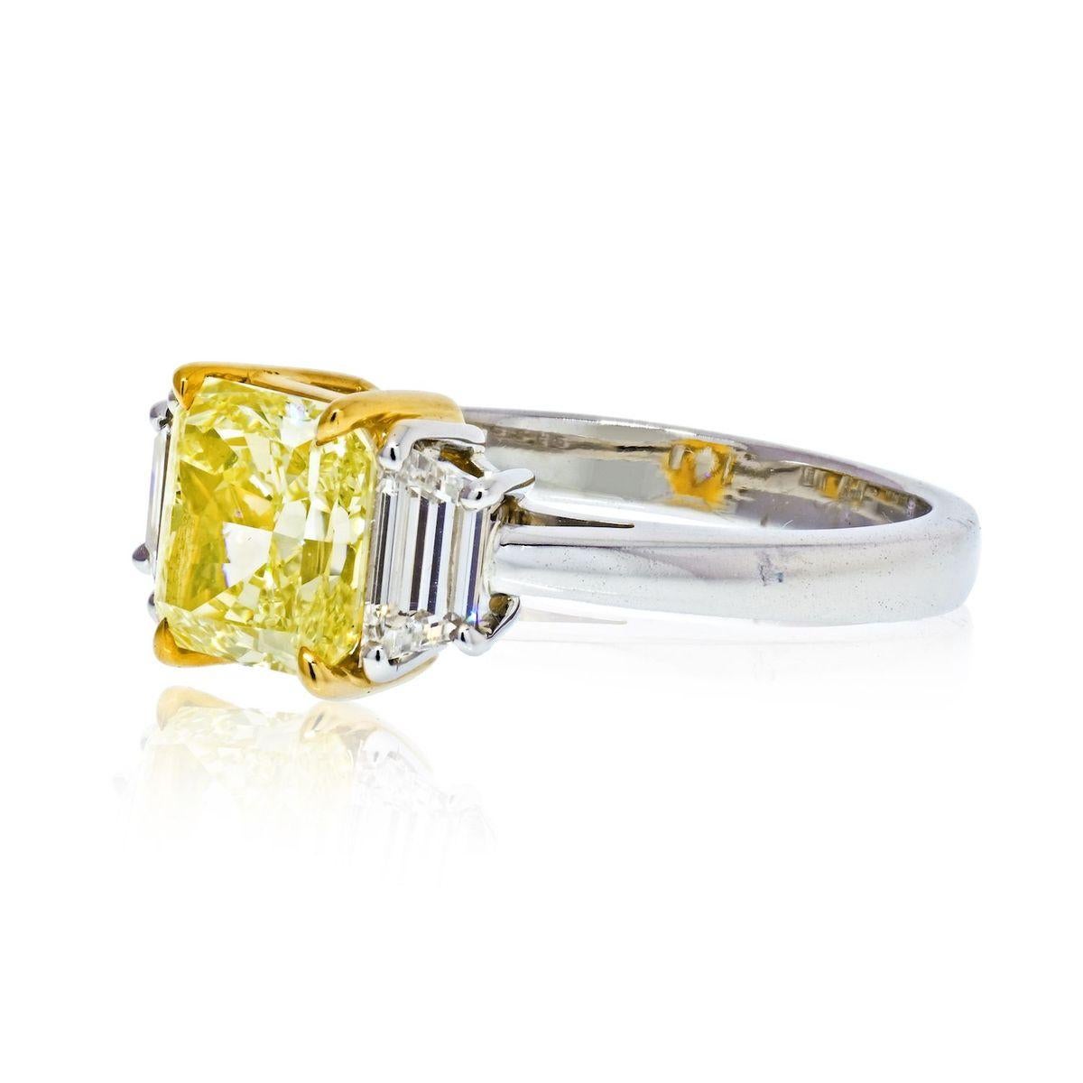 Set with a cut-cornered rectangular modified brilliant-cut Fancy Yellow diamond, between trapezoid diamond shoulders. Fancy Yellow diamond weighing 2.13 carats. Trapezoid diamonds weighing a total of 0.62 carat. Accompanied by GIA report 16312352