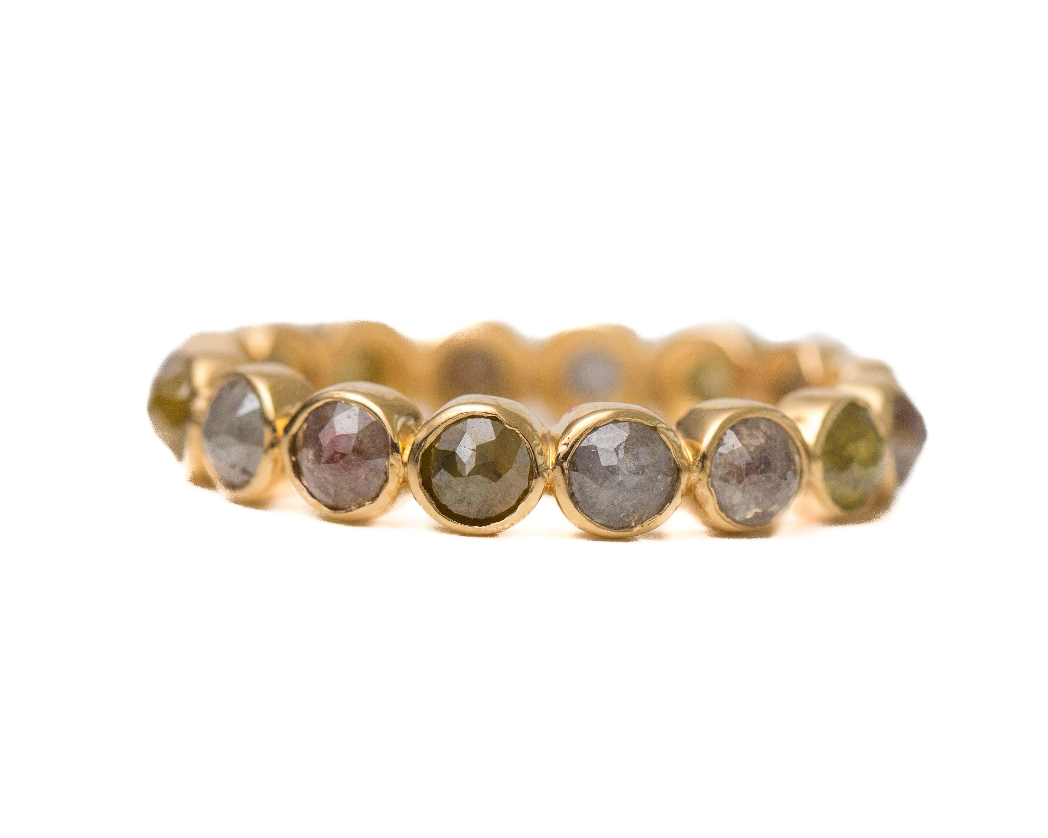 2.0 Carat Rose cut Diamond and 18 Karat Yellow Gold Eternity Band

Features a ring of fancy intense Rose Cut Diamonds in 18 Karat Yellow Gold. The Rose Cut gemstones are bezel set in 18 Karat Yellow Gold. The sides of the ring have a smooth, high