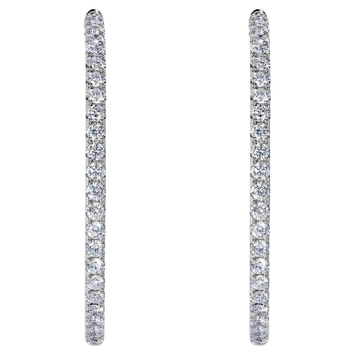 Diamond Hoop Earrings:

Carat Weight: 2.10 Carats
Shape: Round Brilliant Cut
Metal: 18 Karat White Gold
Style: Hoop Earrings