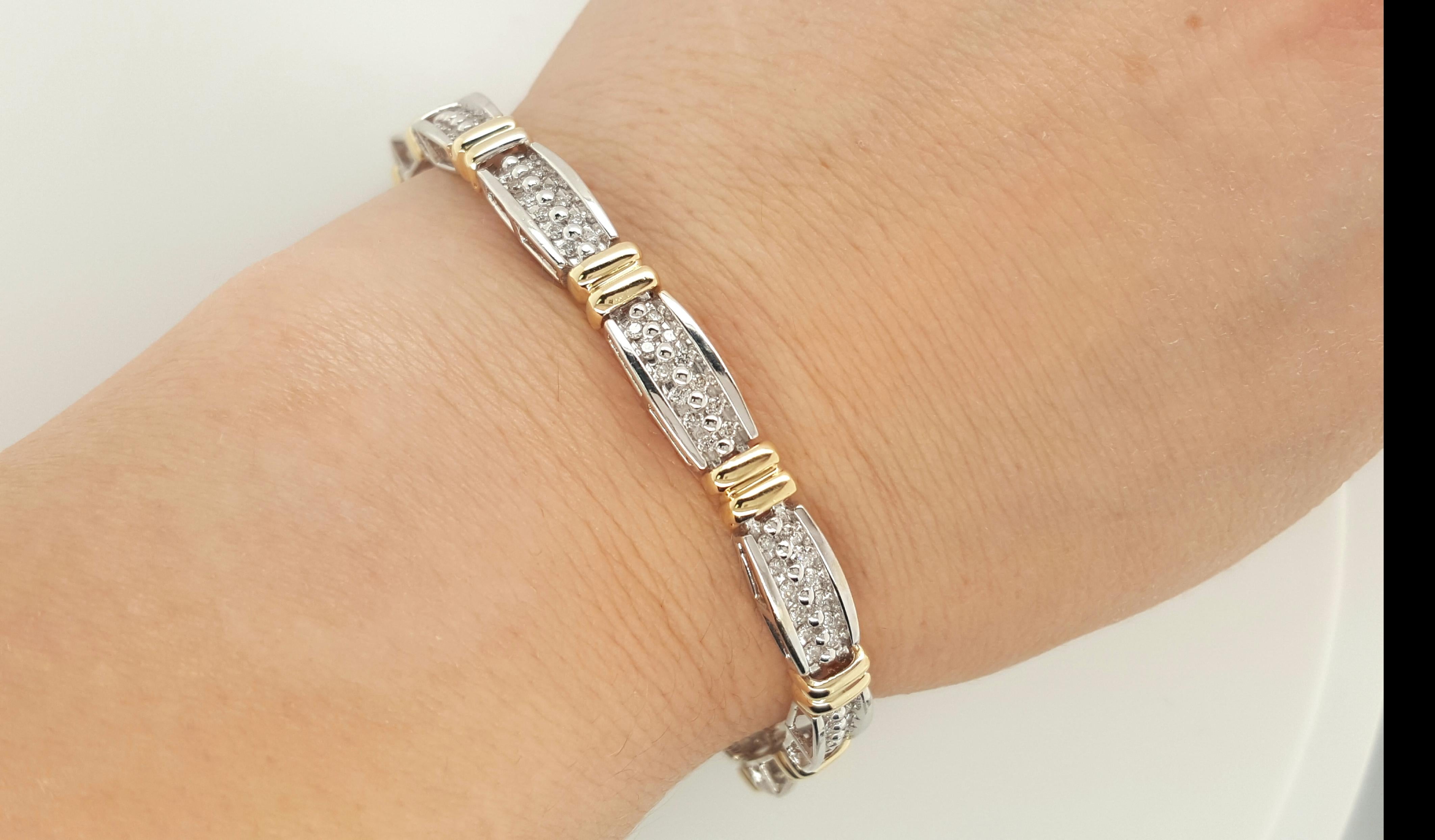 This incredible tennis bracelet is an absolute beauty. The bracelet is made of 14 karat yellow and white gold and sits on the the arm perfectly with flexibility. This bracelet is stunning arm candy that can be enjoyed and admired for any occasion.