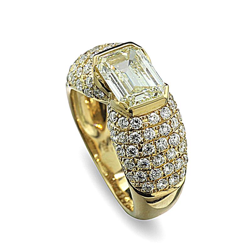 a solitaire ring showcasing a stunning 2.034-carat emerald-cut diamond color: very light yellow, clarity grade: VS1.
Surrounding the centerpiece are 86 brilliant-cut diamonds, totaling approximately 1.20 carats, adding a sparkling halo and a touch