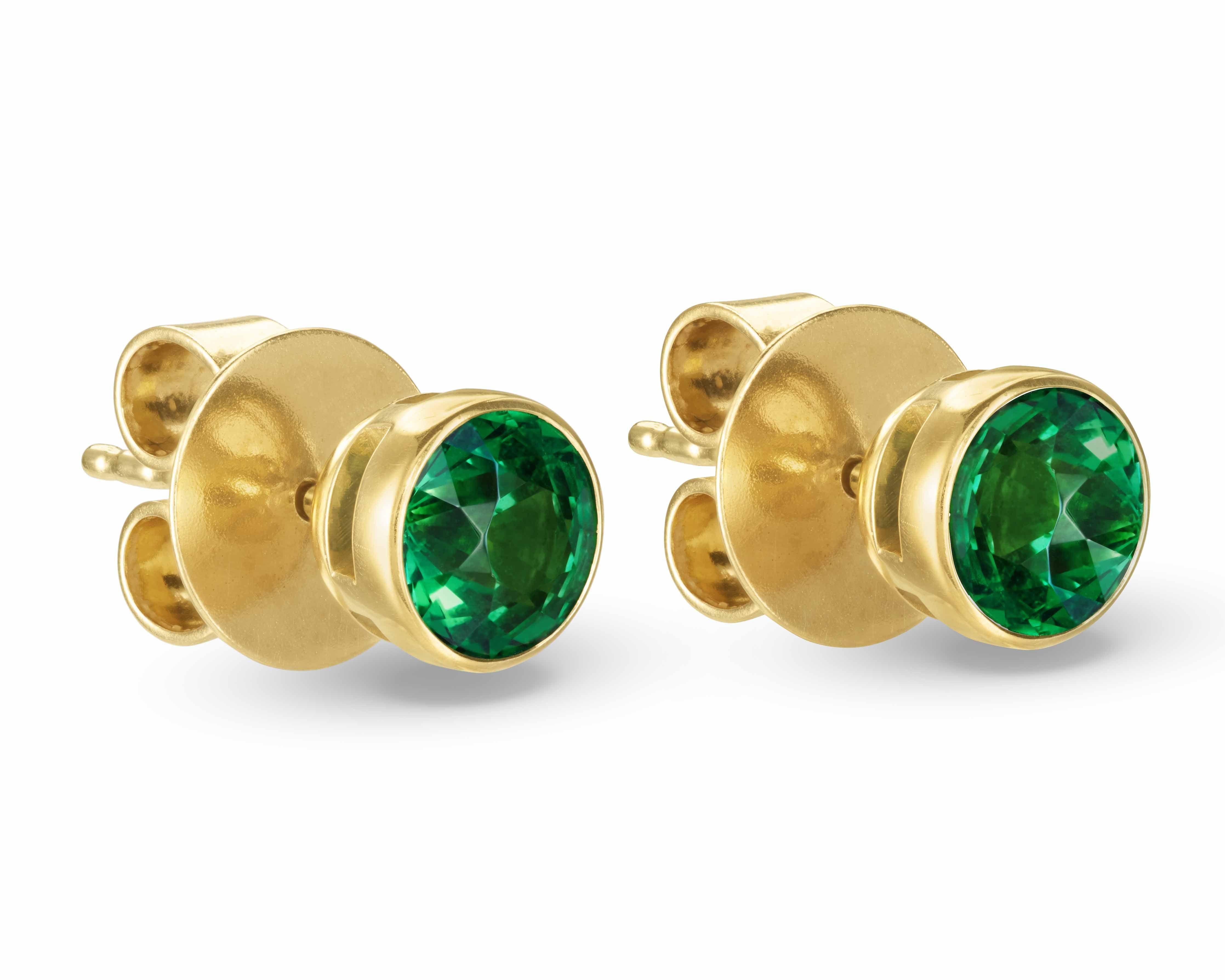 Classic and chic everyday studs. Each earring has a 1 carat vivid green round-cut Tsavorite bezel set in 18K yellow gold.

Total Tsavorite weight 2 carats.

SONYA K. is a New York City-based fine jewelry brand that creates wearable, stone-centric,