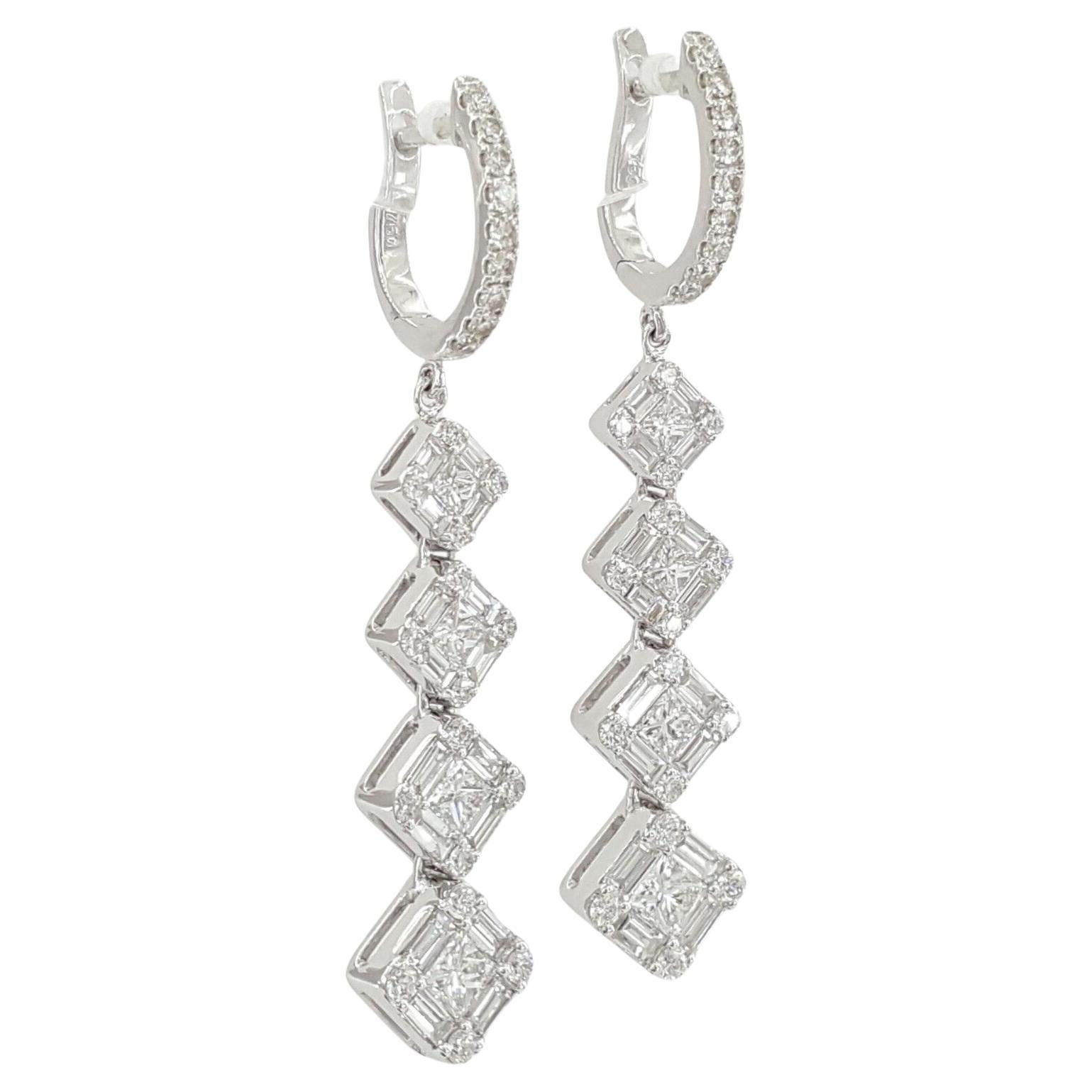 An exquisite pair of dangle earrings set in solid white gold.

the cuts are princess, baguette and round cut.

 There are 12 Natural Princess Cut Diamonds weighing approximately 0.2 ct total weight, E-G in color and VS1-VS2 in clarity. 



18