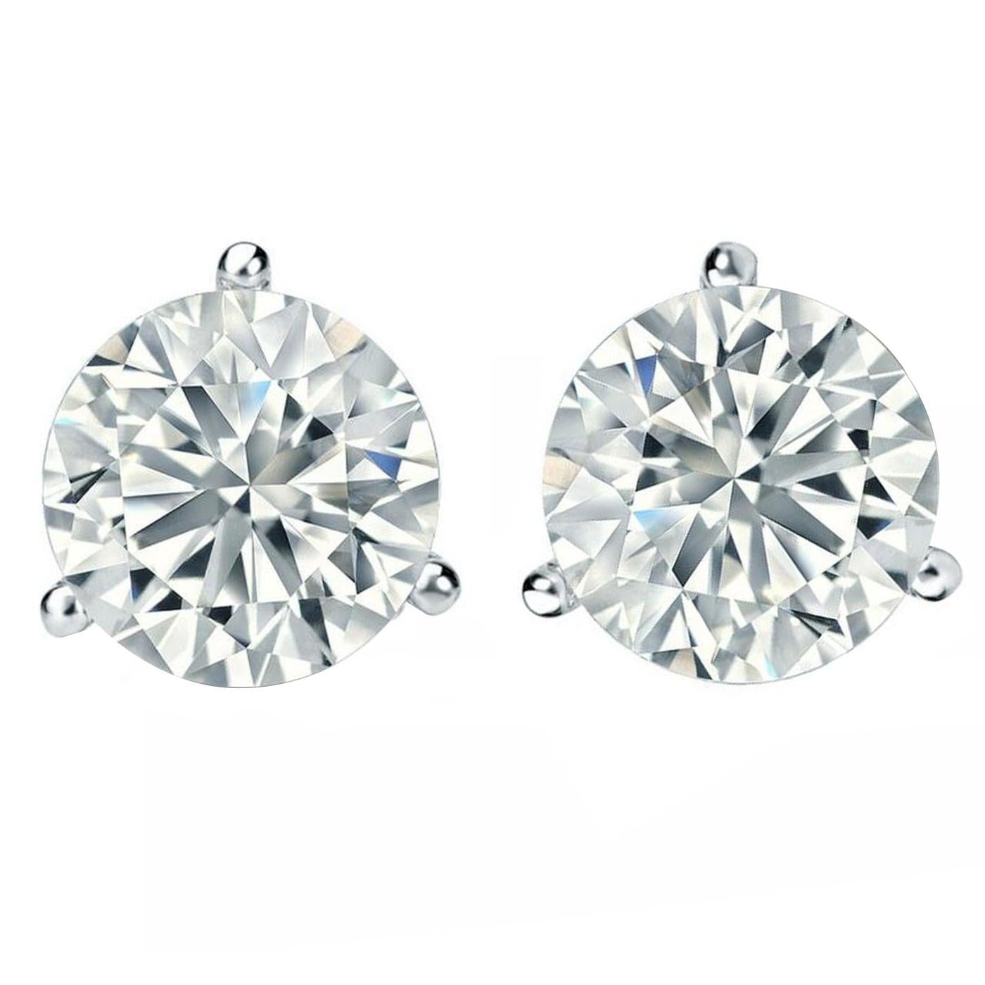 A classic diamond earring featuring 2 Carats diamonds set in a 14k white gold 3-prong Martini Setting. The Diamond Earrings offer a refined and elegant design, adding sparkle and elegance to your look. These diamond earrings can be worn