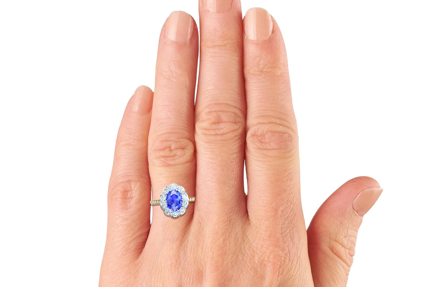 Not much goes better than the combination of blue sapphire and white diamond.  This simple but beautiful sapphire and diamond ring contains the following.  The center stone is apprx. 1.10-1.20 carats and has a gorgeous cornflower blue color, typical