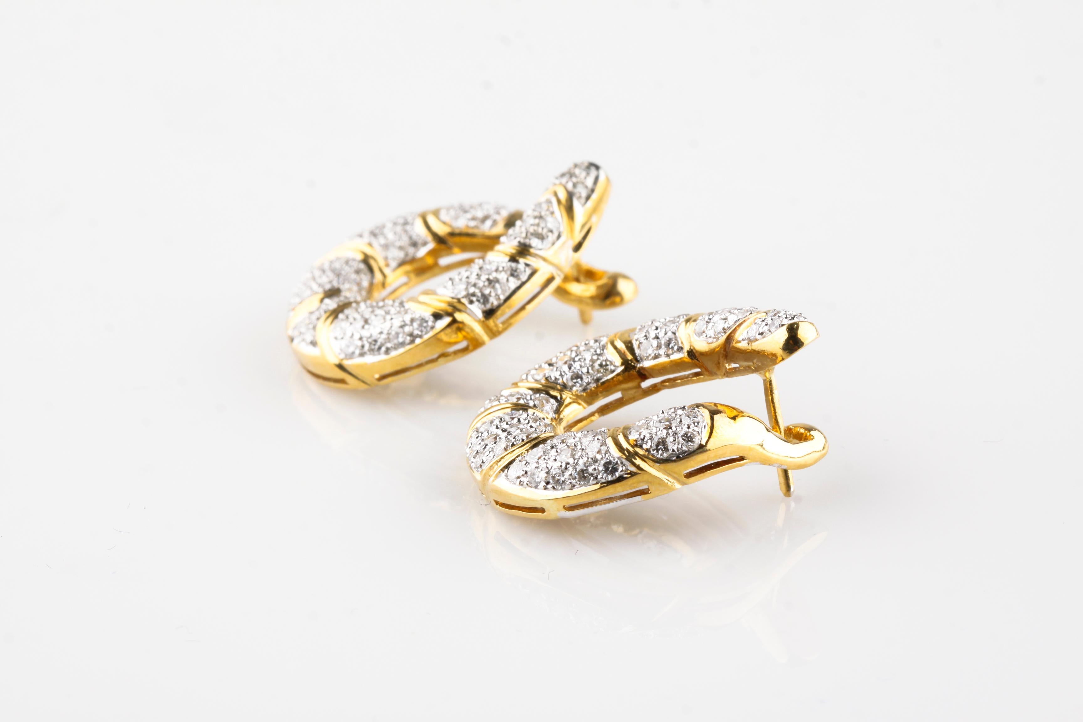 Gorgeous 14k White and Yellow Gold Swoop Post Earrings
Feature Hinged Design Allowing Front to Snap into Back
Total Diamond Weight = 2.0 Cts
Average Color = F - G
Average Clarity = VS
Length of Drop = 27 mm
Width of Swoop = 23 mm
Total Mass = 16