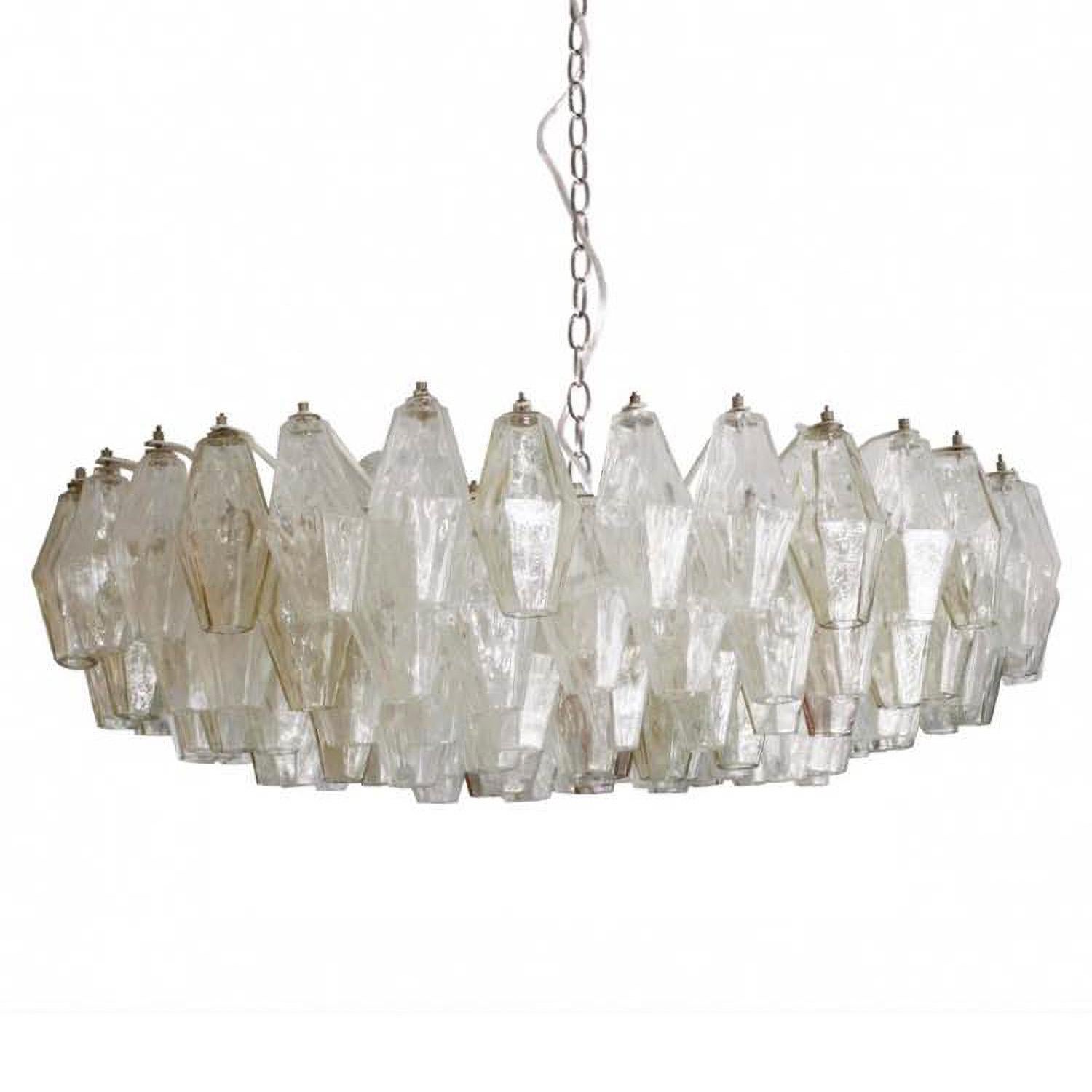 Pair of splendid polyhedron chandeliers by Carlo Scarpa for Venini production Towards the middle of the fifties they are in blown glass and are of the first edition.
They are composed of more than 200 polyhedra each, they are mounted on their
