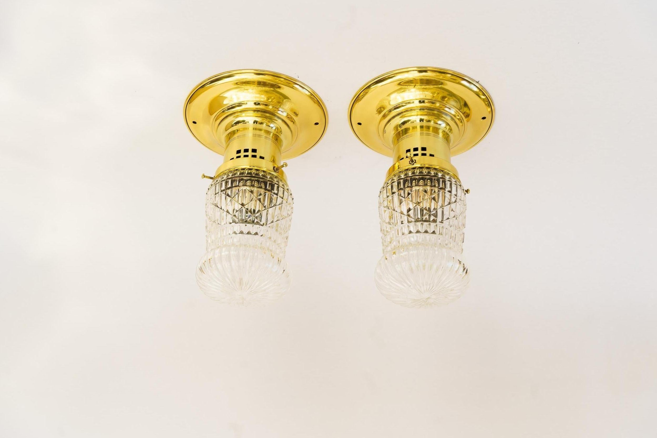 2 ceiling lamps vienna around 1920s
Brass polished and stove enameled
Original antique cut glass shades