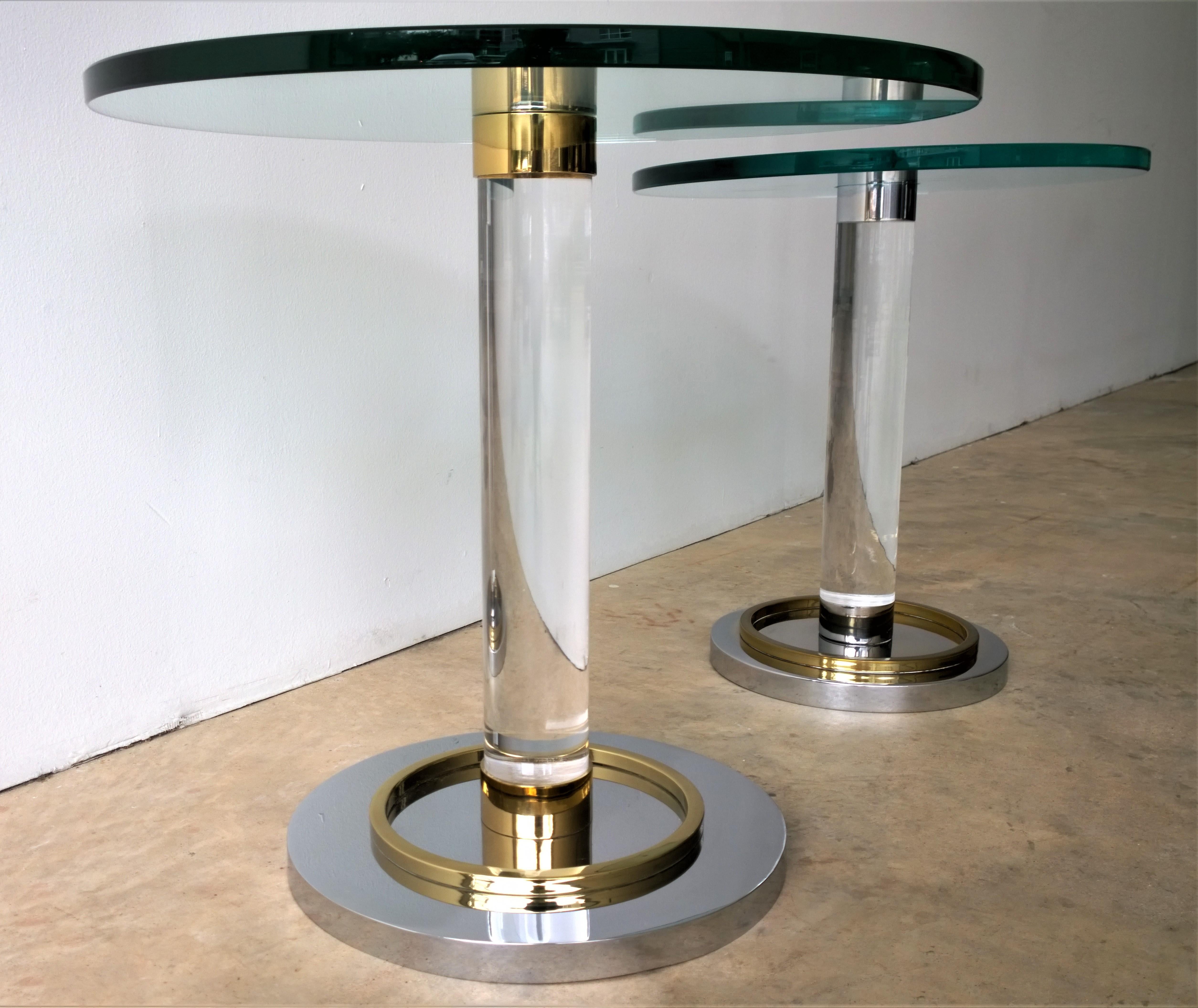 Offered is a Mid-Century Modern stunning pair of stair stepped occasional/ drinks/ side/ stacking / cocktail tables of Lucite, glass, brass and chrome designed by the godfather of Lucite, Charles Hollis Jones. This design is a true example of old