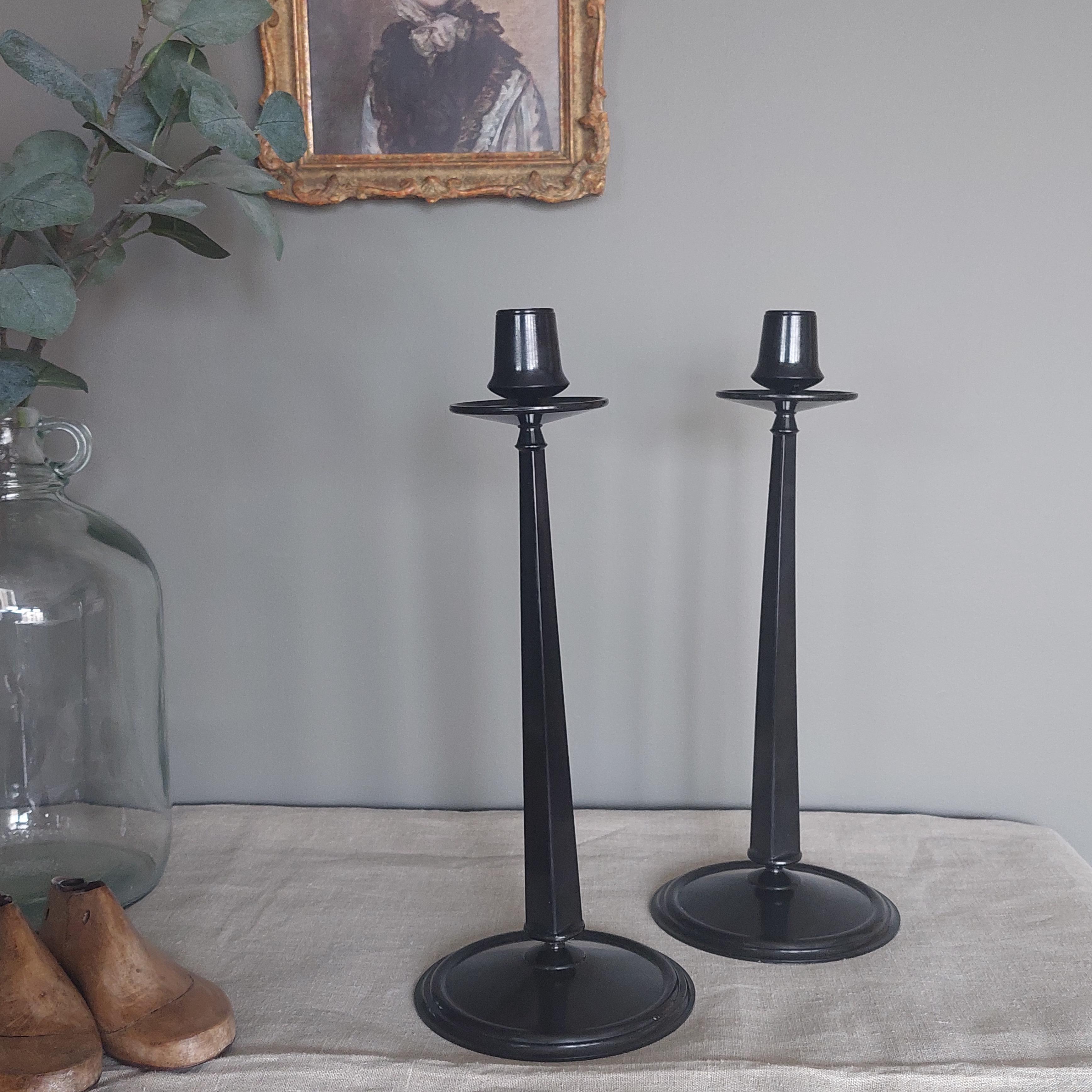 An elegant pair of Jugendstil tall tapered Bakelite candlesticks. 
This iconic Bakelite candlestick is pictured in all the reference books about collectible Bakelite.

These pieces were manufactured by Linsden Ware, England, in the late 1920s on an