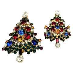 2 Christmas tree brooches, rhinestones on large and small on signed Warner US