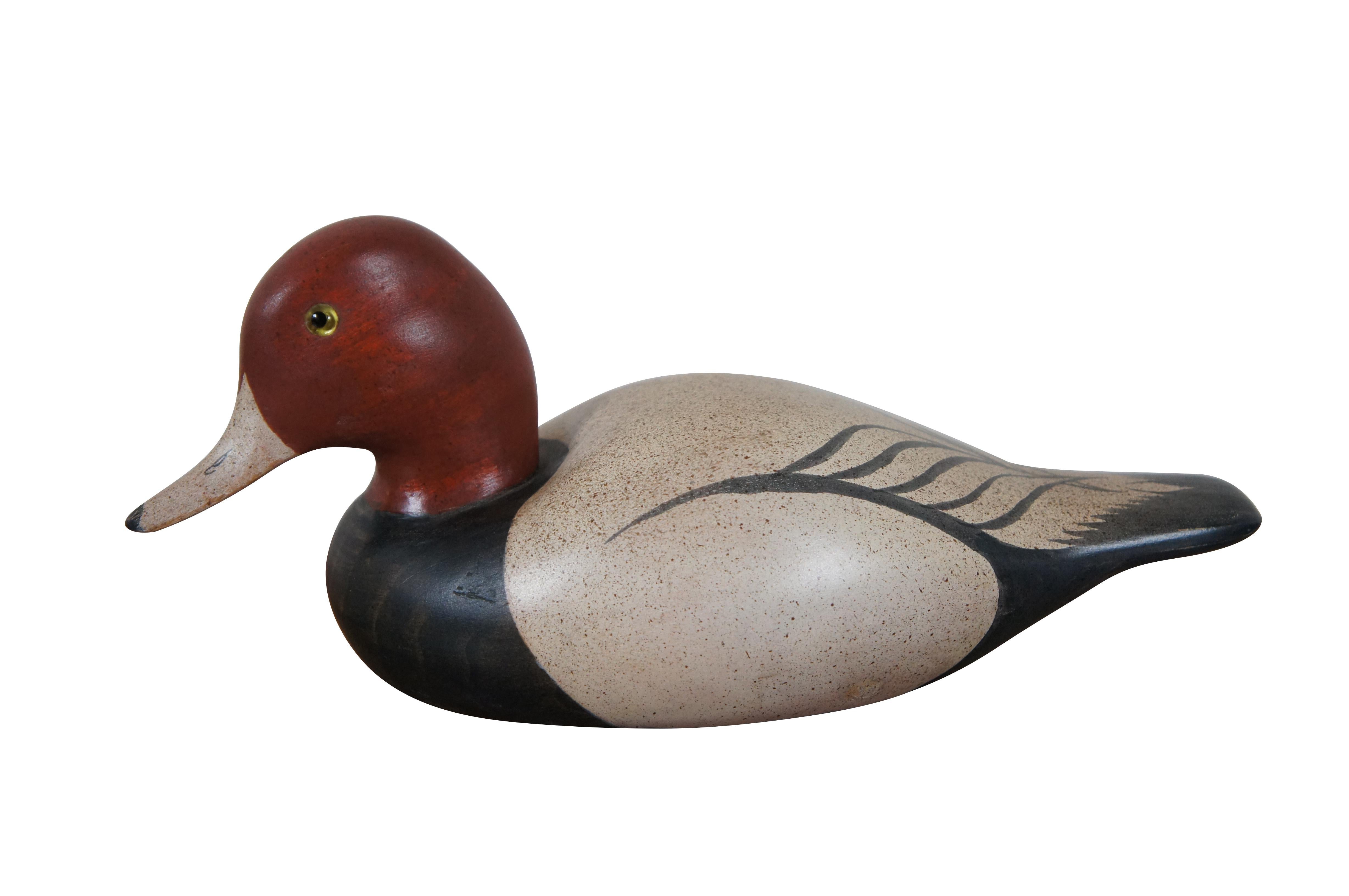 Pair of vintage carved and painted wooden duck decoys / figurines - one Redhead Drake and one Red-breasted Merganser - signed by artist craig Fellows of Big Sky Carvers of Bozeman, MT and dated 2/15/81. 

Dimensions:
11.25