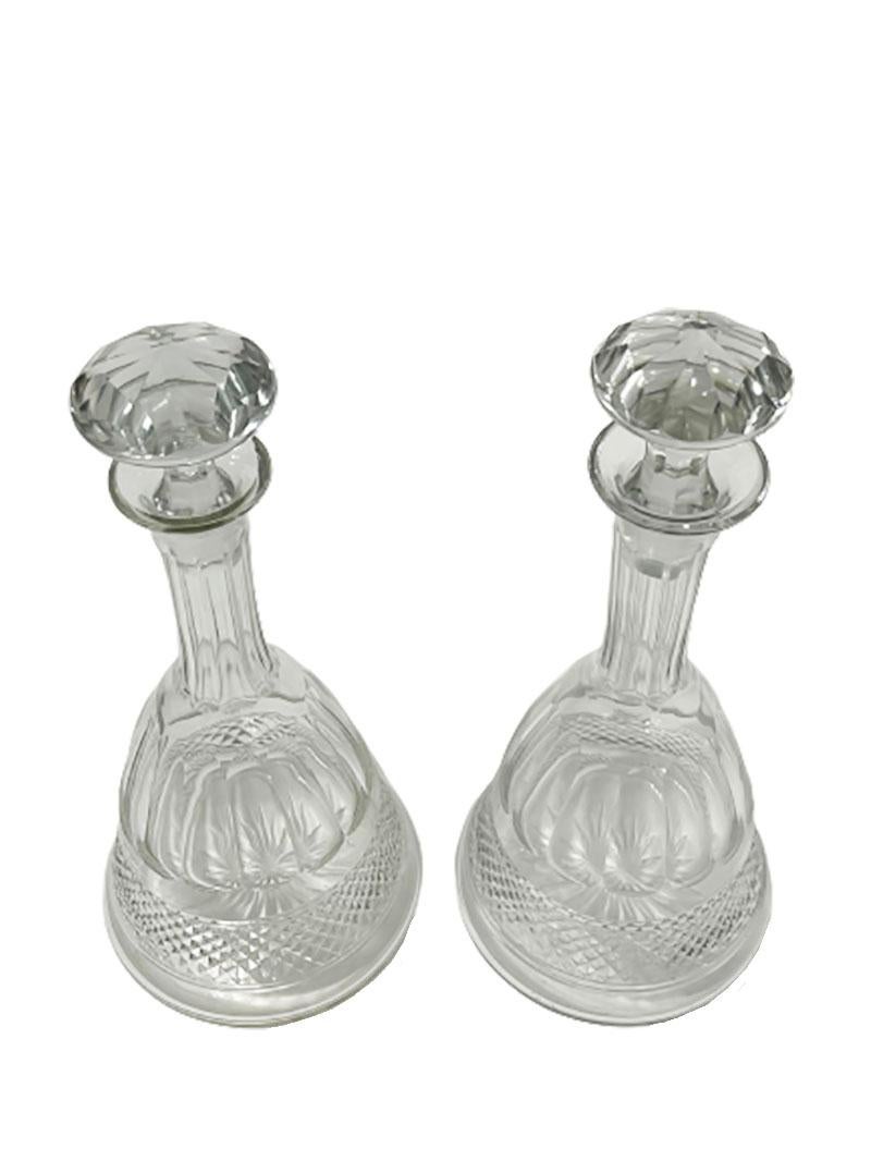 2 crystal ship decanters in bell shape. 

Bell shaped decanters, diamond cut and star cut shape bottom
1 Stop has a saw cut. 
Used decanters from the 60s / 70s, but in very good condition

Measures 32.5 cm high and 14.5 cm diagonal
1 decanter