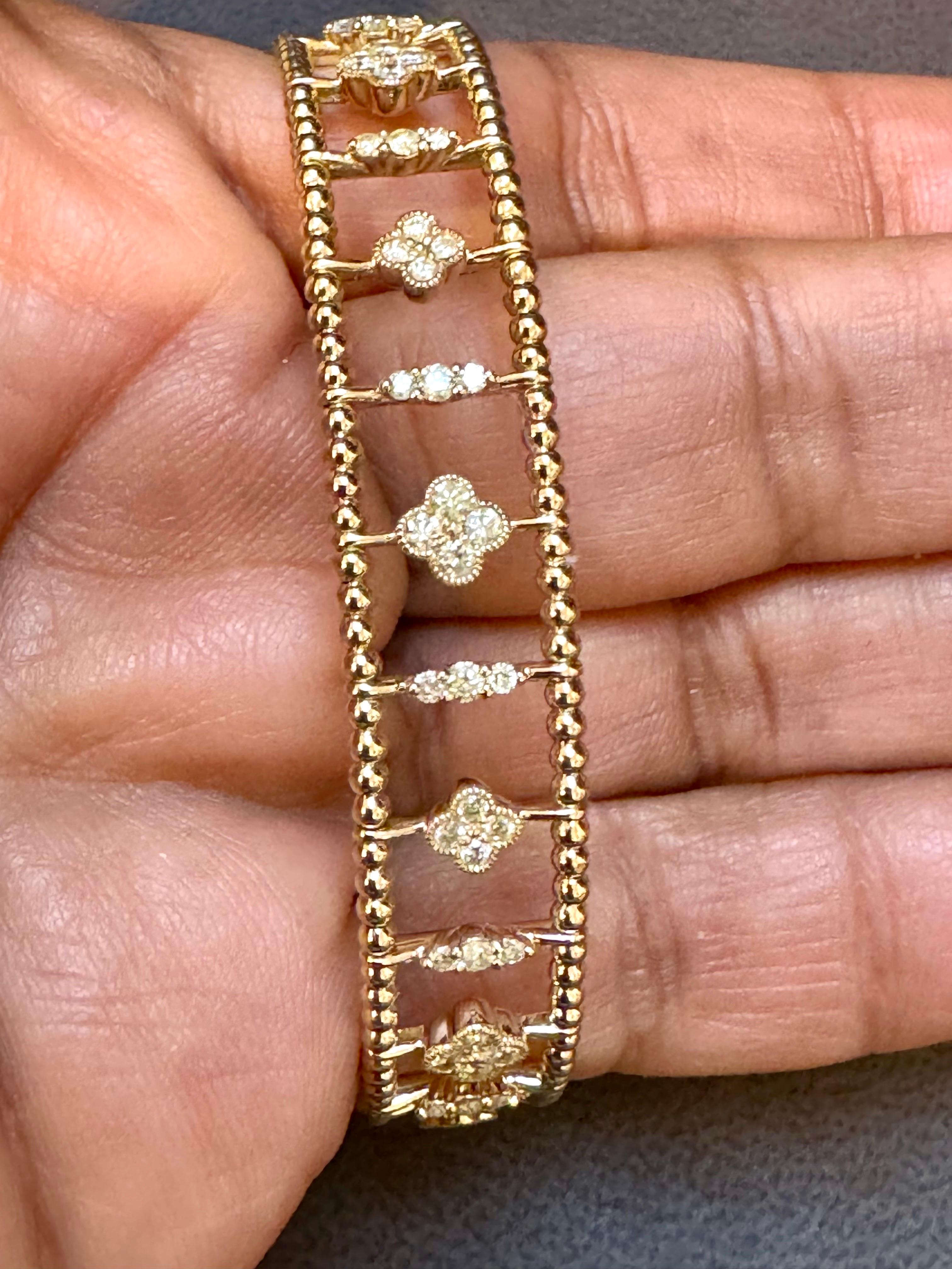 
2 Ct Brilliant Cut Diamond Metro Women 14 Kt Yellow Gold Diamond Bangle Bracelet
Streamlined and modern, this Metro collection twinkles like a nighttime city skyline.  4 diamonds in  each flower , separated by a three diamond bar  effortlessly