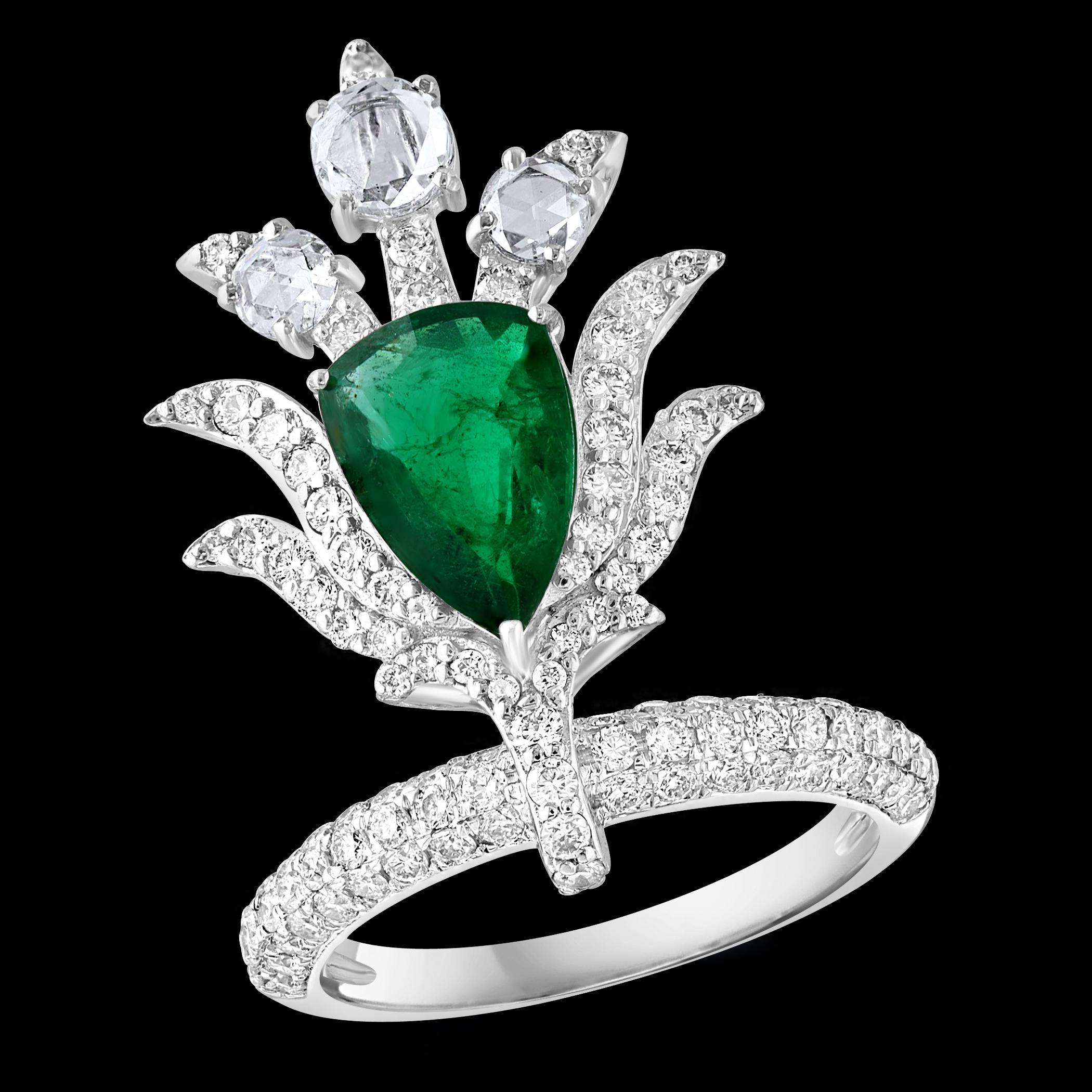 2 Ct Finest Zambian Pear Emerald & 2 Ct Diamond Ring in 18 Kt Gold Size 7. This classic ring features a pear-shaped Zambian emerald of extreme fine quality, boasting a desirable color and luster, originating from Colombia. Accompanied by 3