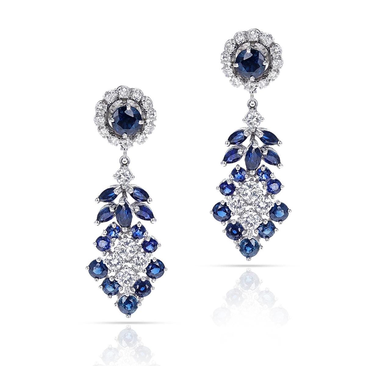 A 2 ct. Round Diamond and 3.50 ct. Round Sapphire Dangling Cocktail Earrings made in 14K White Gold. The total weight is 10.90 grams. The length is 1.60 inches. 