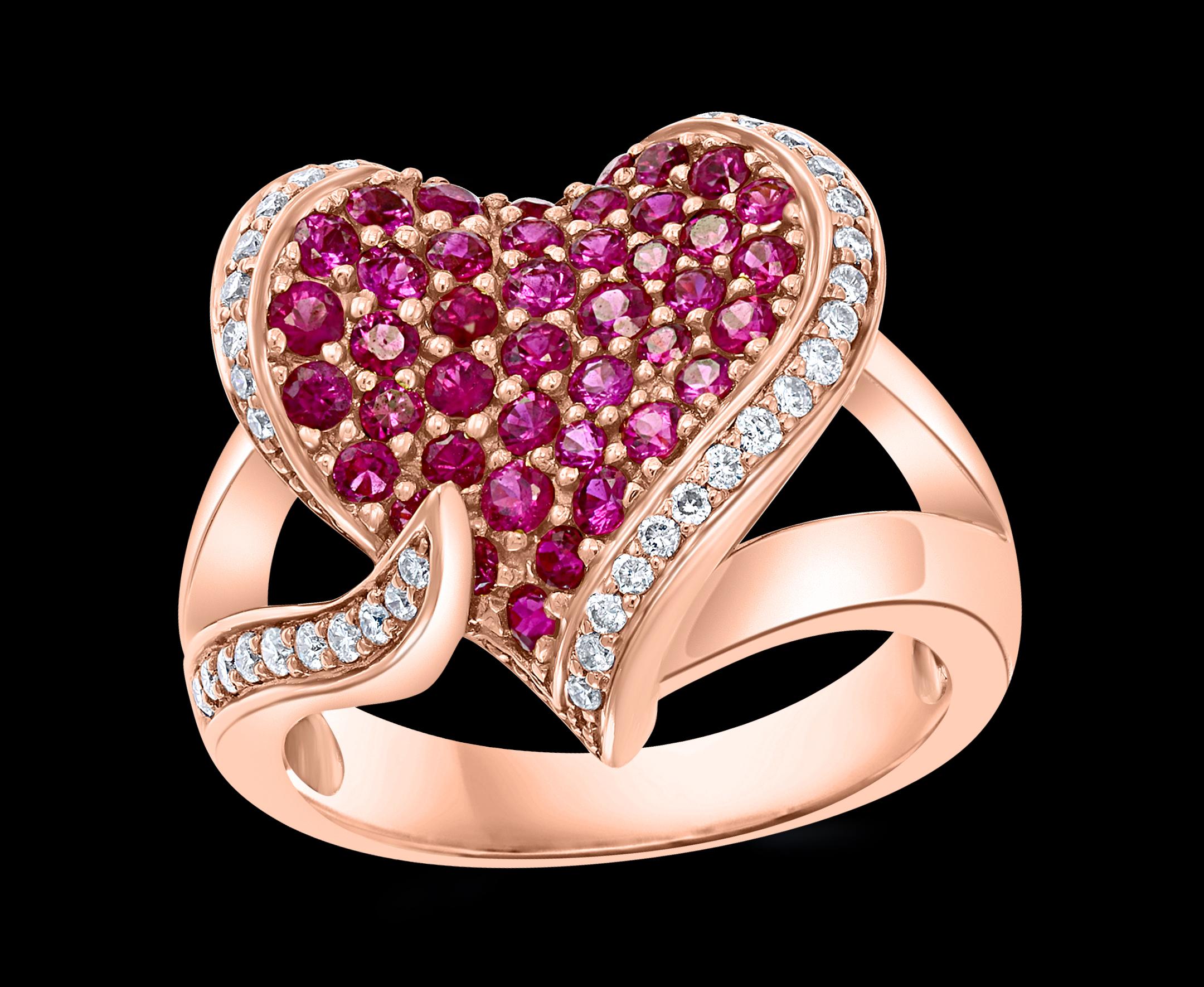 A classic, Cocktail ring 
2 Ct  Ruby & 0.75  Ct  Diamond 18 Karat  Rose Gold Heart Shape  Ring
Ruby  approximately 2 ct
Diamonds   approximately  0,75 ct. All round brilliant cut diamonds
18 Karat Rose Gold: 9.2 Grams
 Stamped  for 750
Ring Size 8 