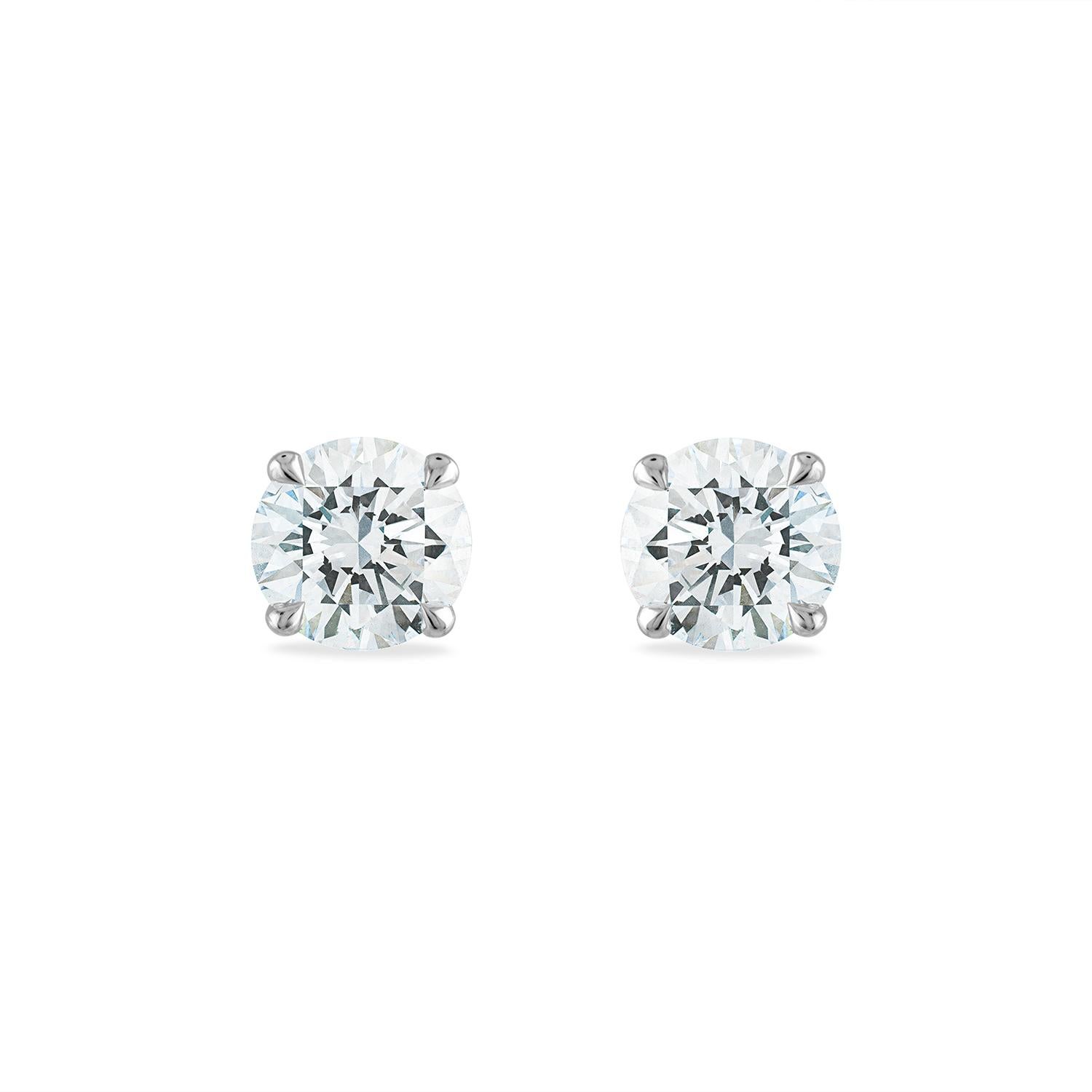 2 Ct Total weight Diamond stud earrings.
Both diamonds are GIA Certified, I color, SI2 Clarity. 
Both stones are rated Excellent Cut, Excellent Polish, and Excellent Symmetry - the highest possible score within the GIA grading evaluation. 

Set in