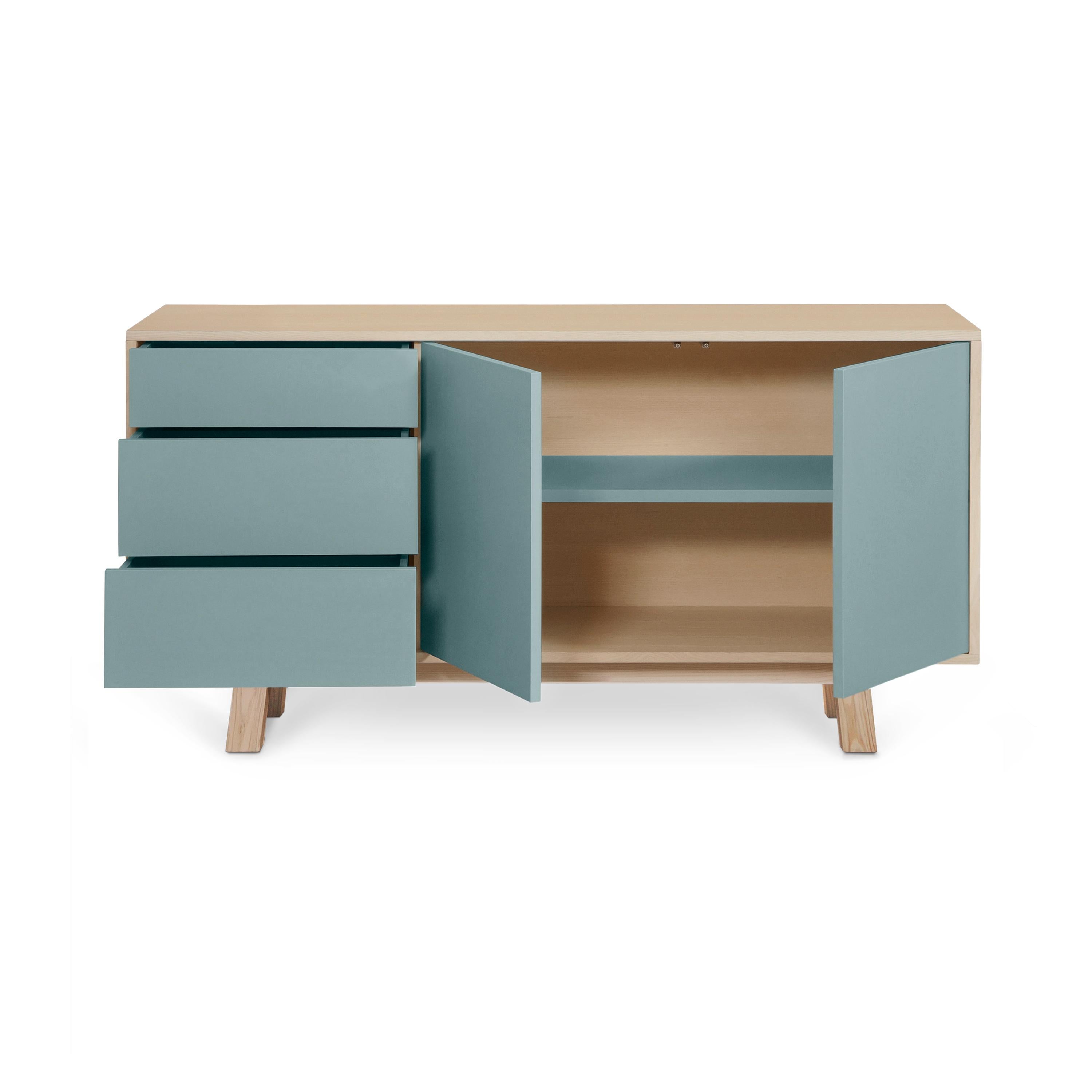 This 2 doors and 3 drawers sideboard is designed by Eric Gizard - Paris.

It is 100% made in France with solid ash wood, veneer and lacquered doors in MDF panels. 

Each door and each drawer opens with a 