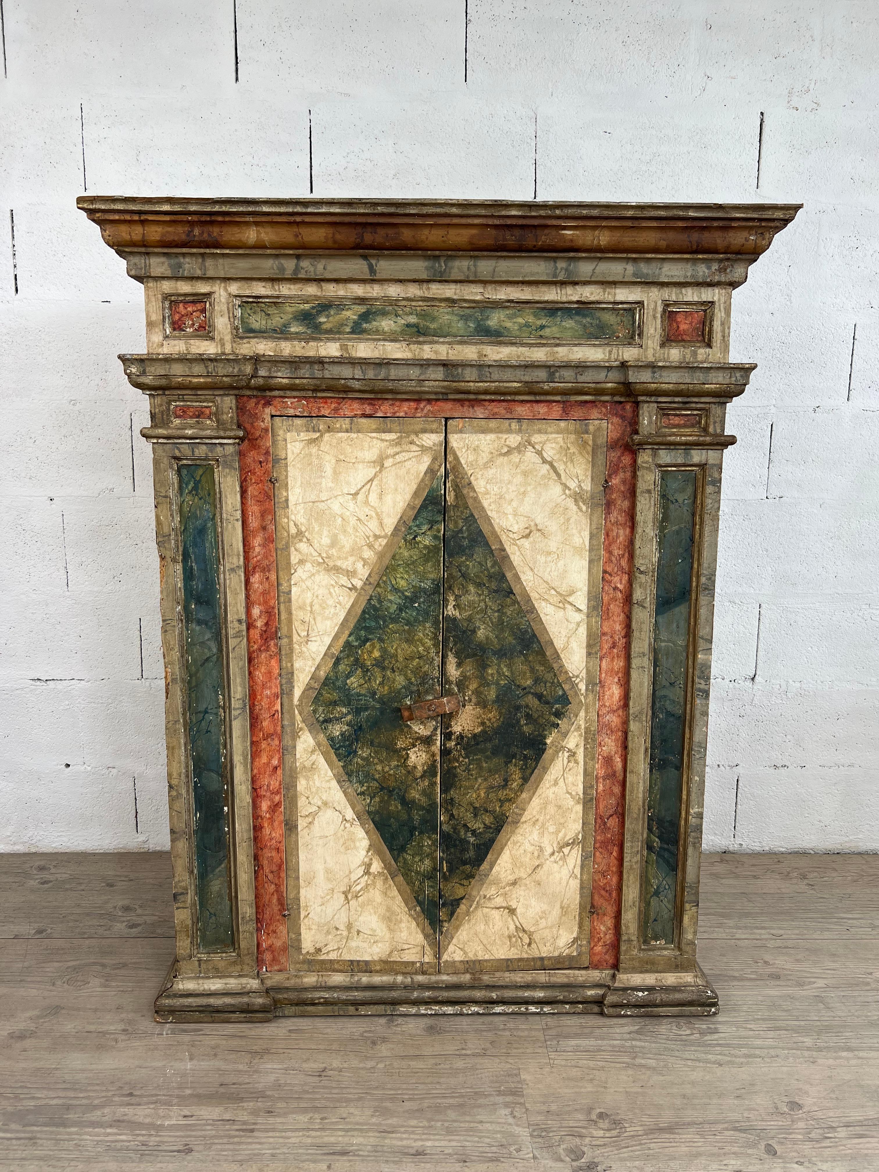 This exquisite 18th-century Italian buffet is a remarkable example of the art of faux marble painting, a technique in which Italian artisans excelled. With meticulous craftsmanship, the painted surface masterfully mimics the texture and veining of