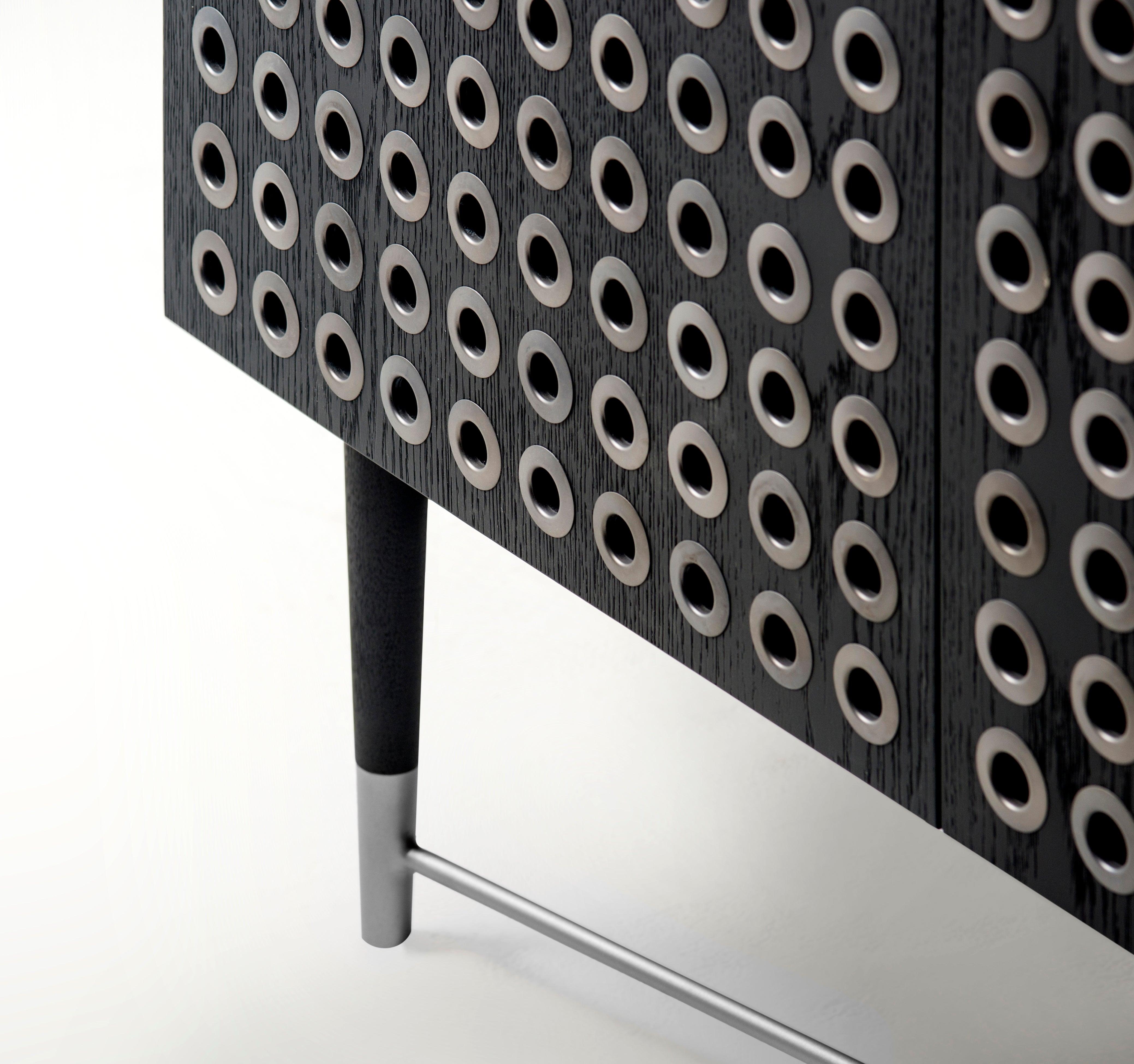 The Kuro cabinet’s character and personality are the aftereffects of highly developed applications of industrial design materials into the surface design of this piece, making it an instantly recognizable design.

Crisscrossing over modern and