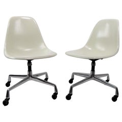 2 Eames Fiberglass Swivel Chairs on Aluminum Group Bases
