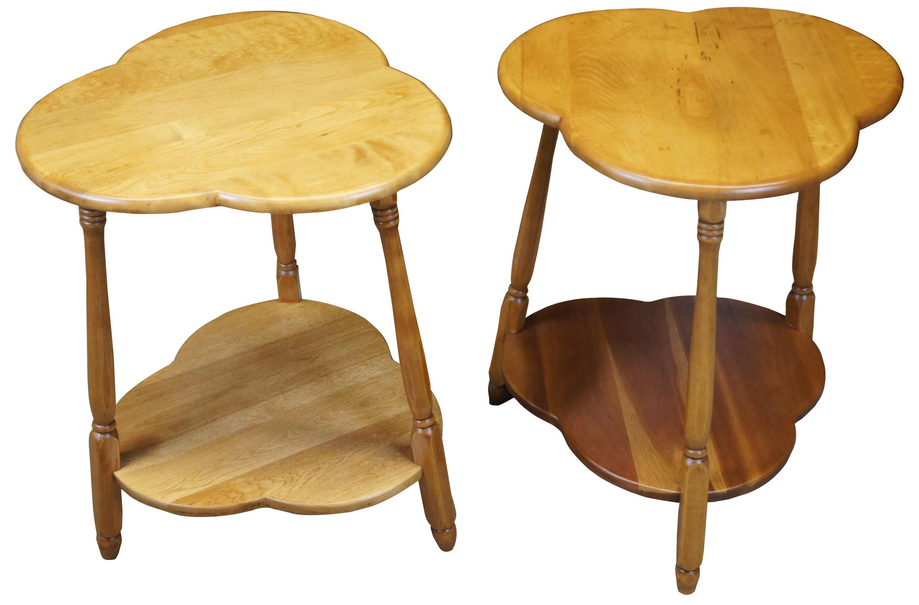 Two handmade trefoil tables. Features a trefoil top and lower shelf, supported by turned spindle legs. Made from Birch.
  