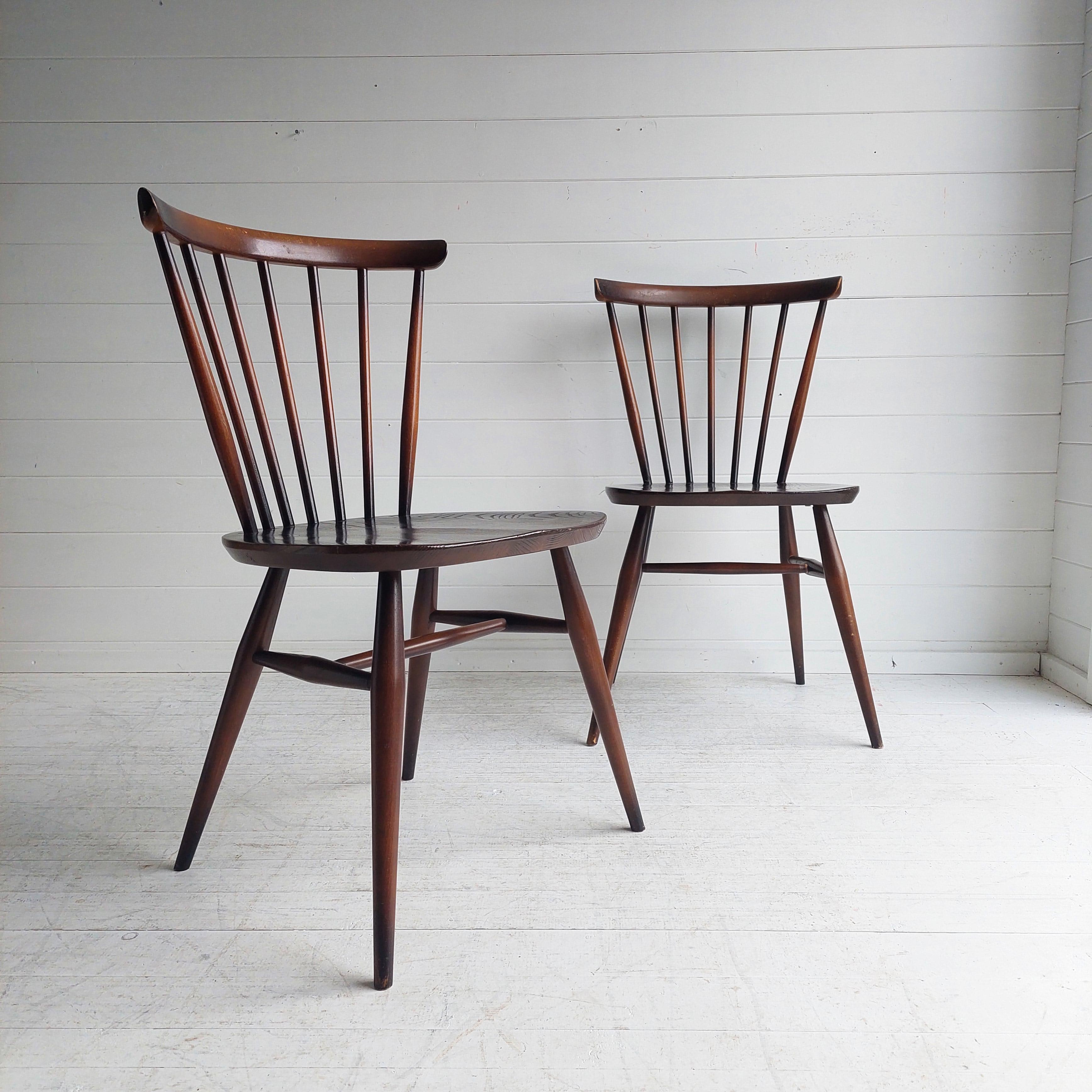 A set of 2 vintage Ercol model 449 bow back dining chairs.
Original dark brown finish
Beautifully designed and crafted model 449 stick back chairs designed by Lucian Ercolani for Ercol in the 1950/60s.
A classic of the Ercol design