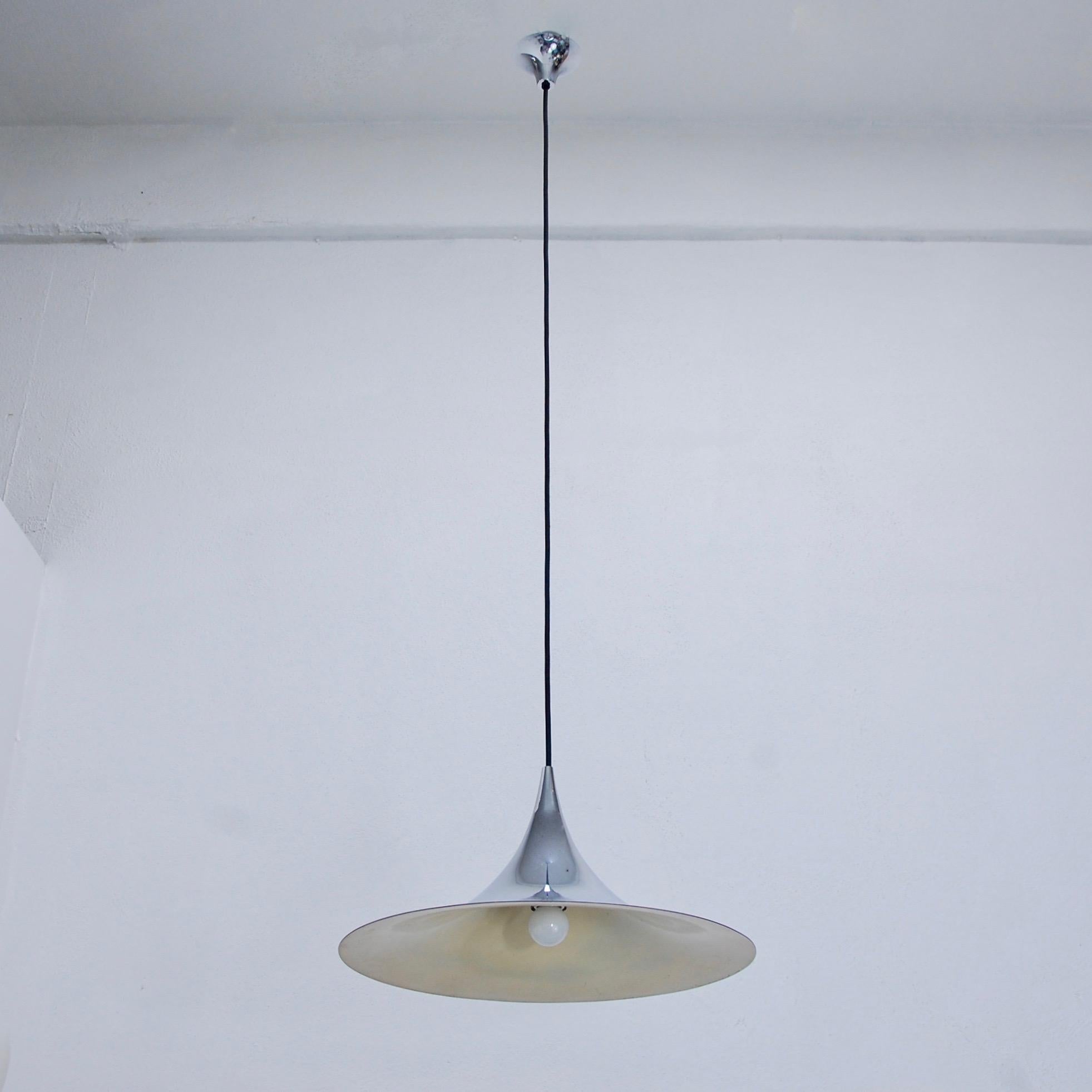 Nickle plated Fog and Morup Style Pendant from Denmark. Original finish. Wired with a single E26 medium based socket for the US. Light bulb included. Overall drop adjustable upon request.
Measurements:
OAD: 48”
Fixture Height: 10”
Diameter: 20”
    