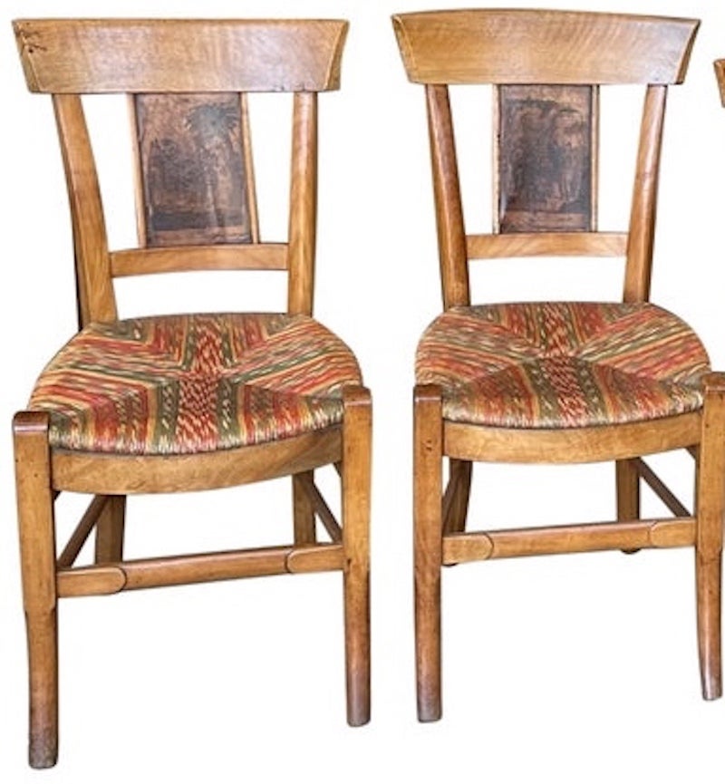 These are 4 19th Century French dining chairs with unusual coloured rush seats. They are in very good condition except the high back of one of the chairs has been repaired.