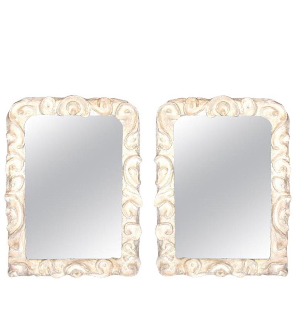 2 Dramatic and Poetic French Mid-Century Modern style wall mirrors composed of handcrafted plaster in the style of Serge Roche. Serge Roche worked heavily in plaster creations and mirrors were a great object of fascination for him. These pieces